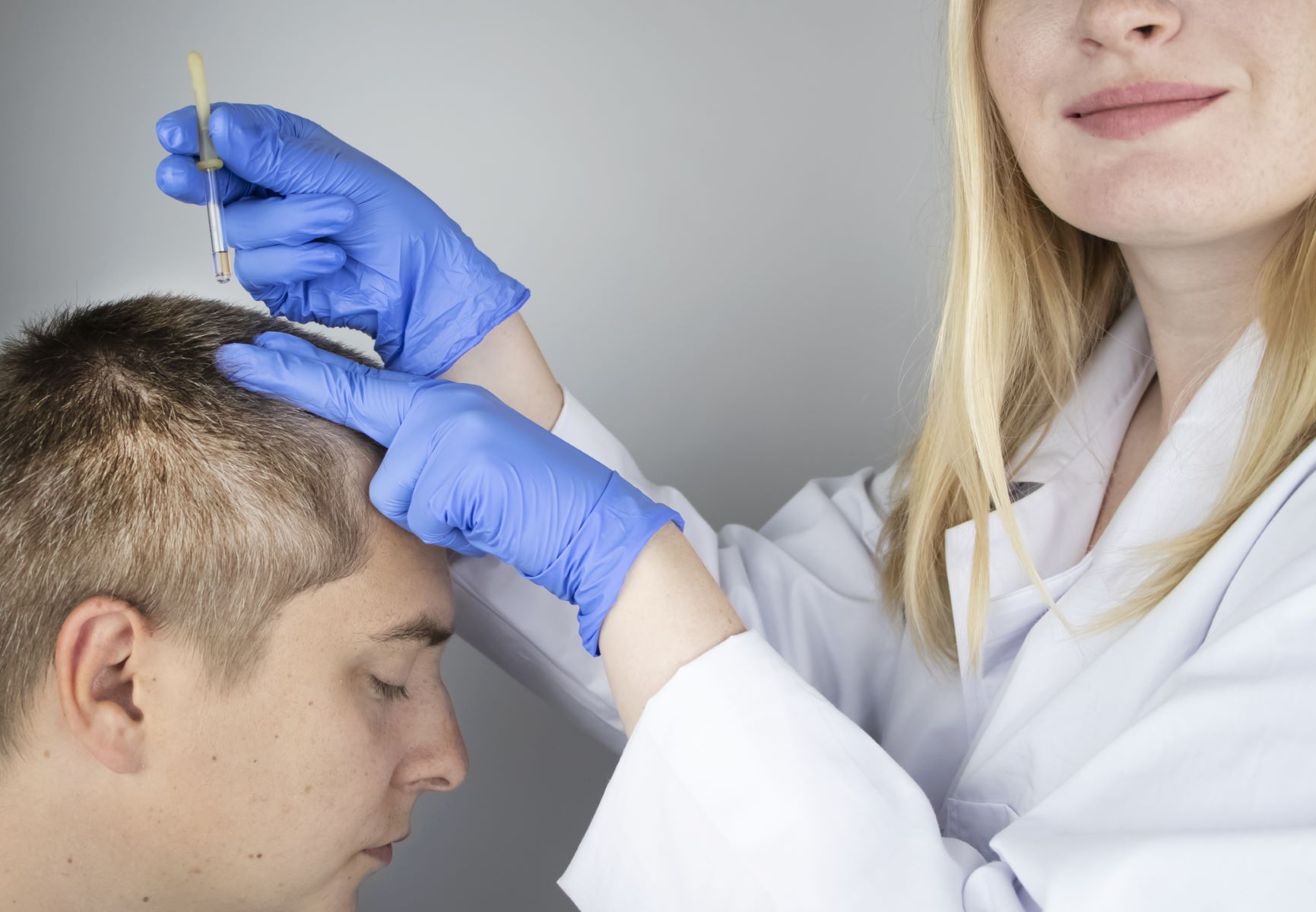 Man getting scalp eczema treatment