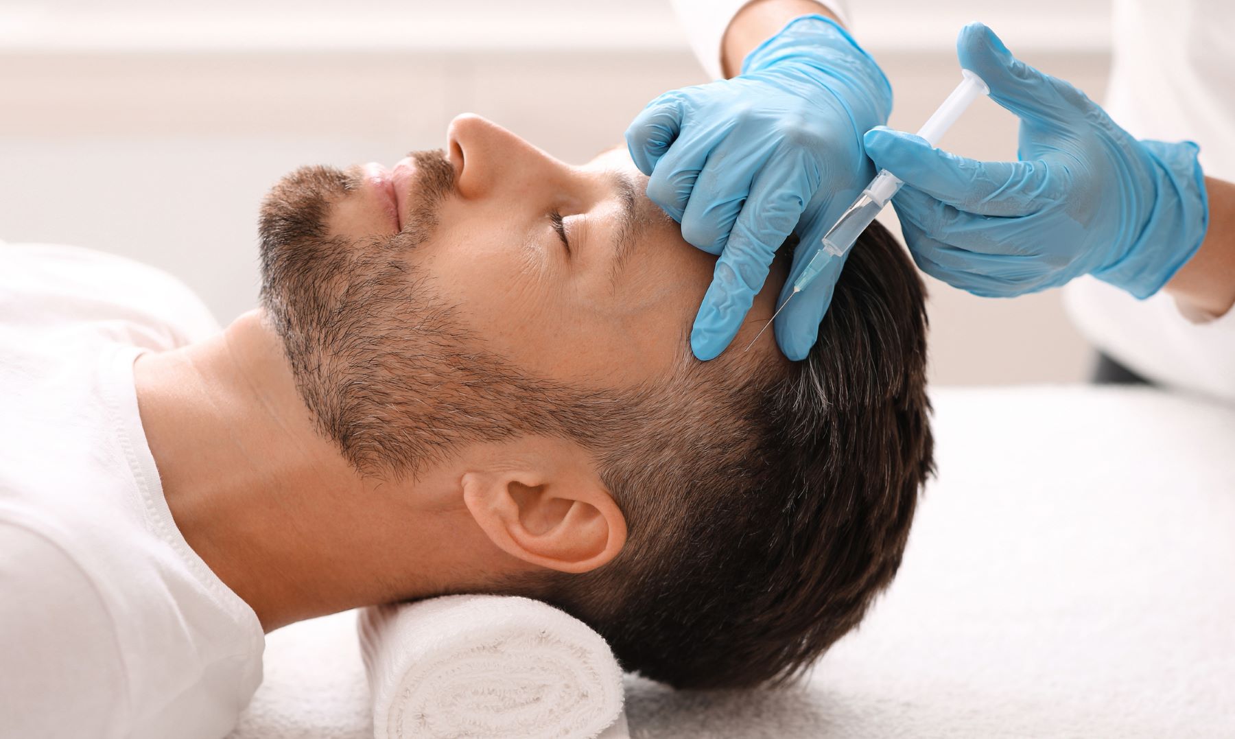 Man receives PRP treatment for hairline regrowth