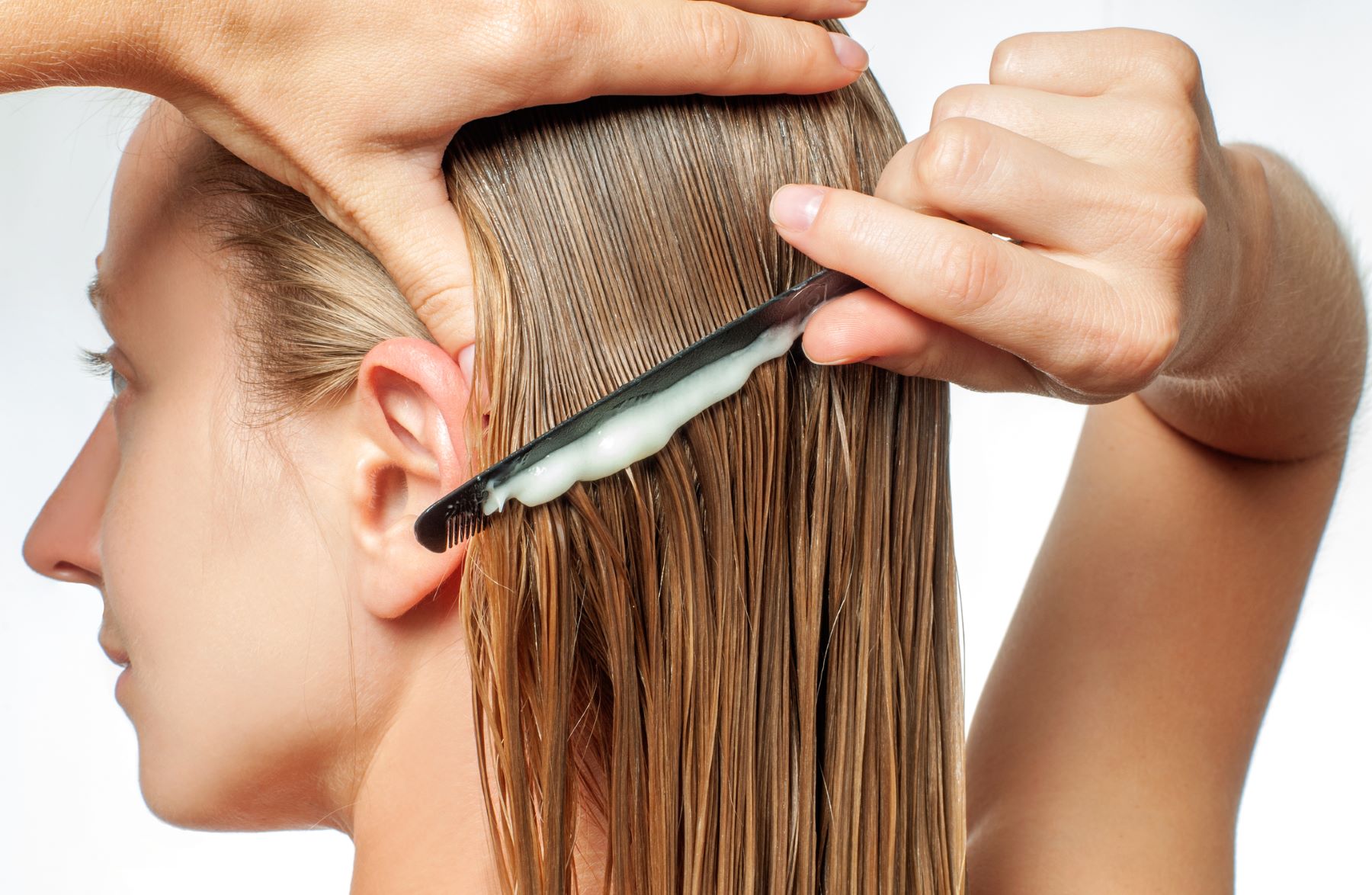 Woman detoxing her hair and scalp