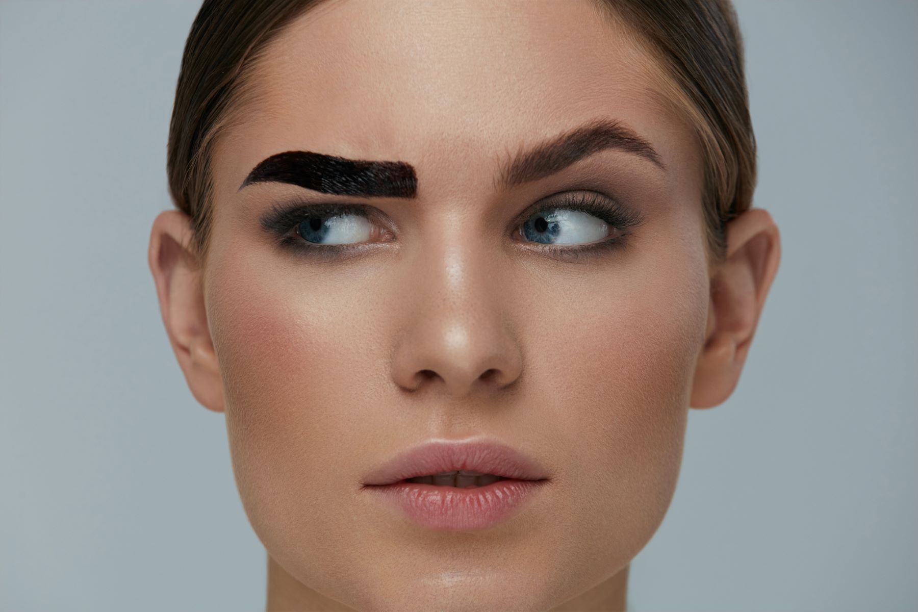 Woman following eyebrow trends