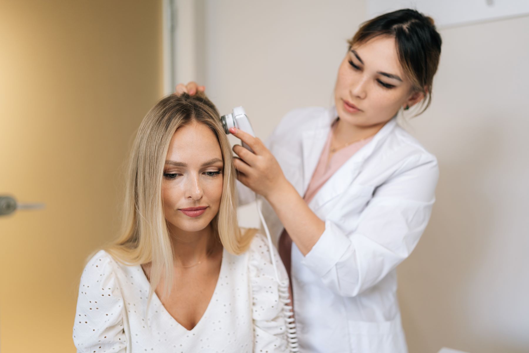 Woman getting advice from a hair specialist