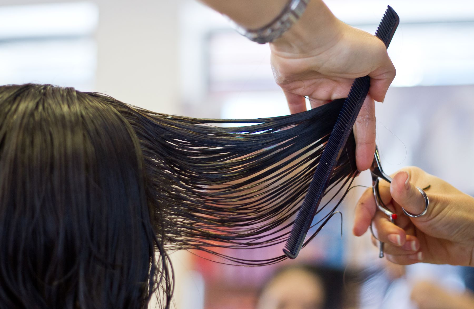 Woman getting her hair cut shorter