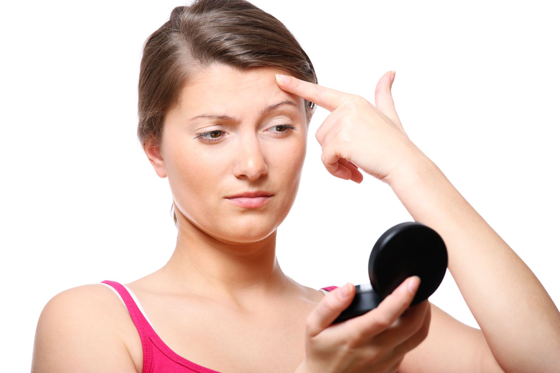 Woman inspecting her eyebrow design