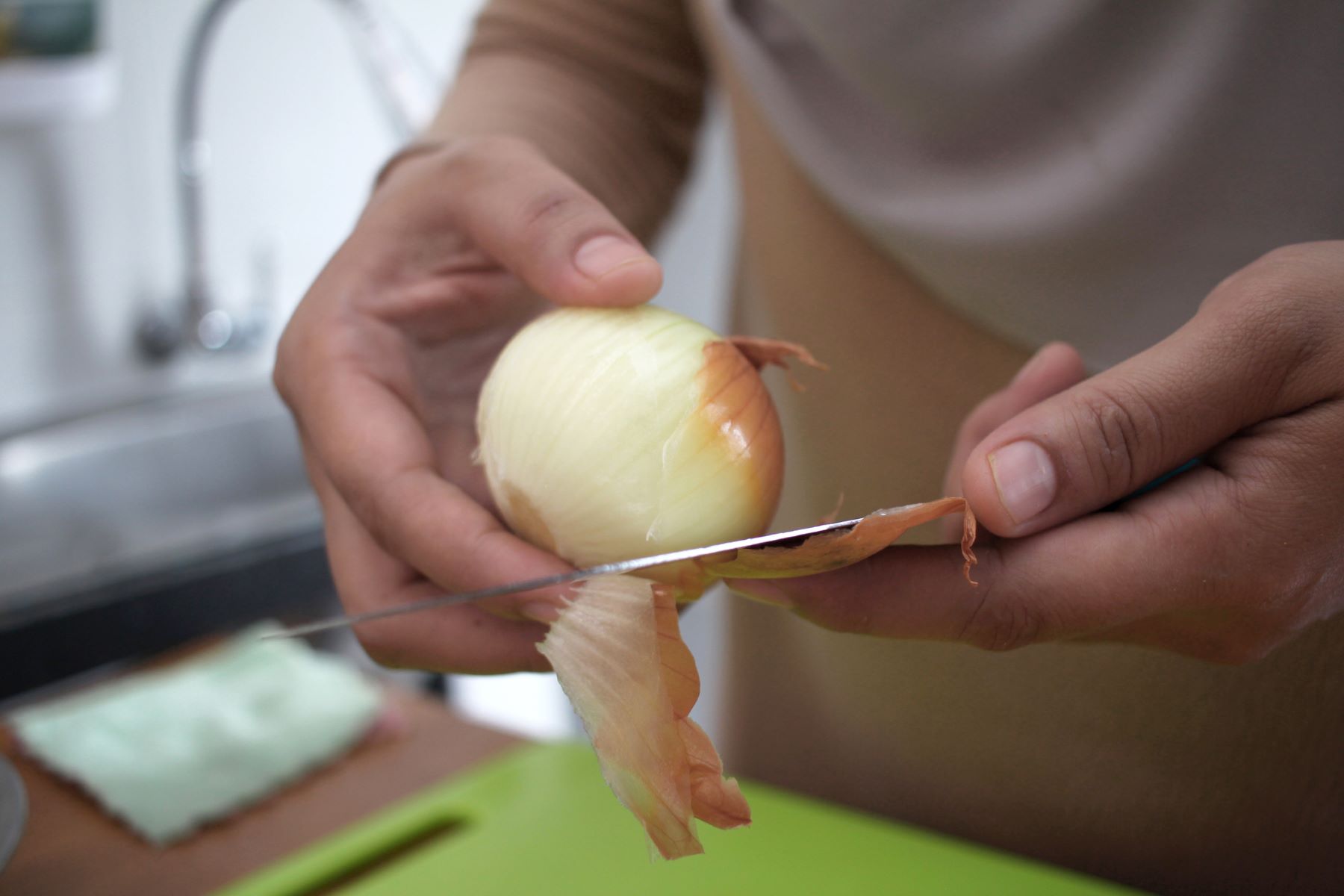 Woman preparing onion juice for hair