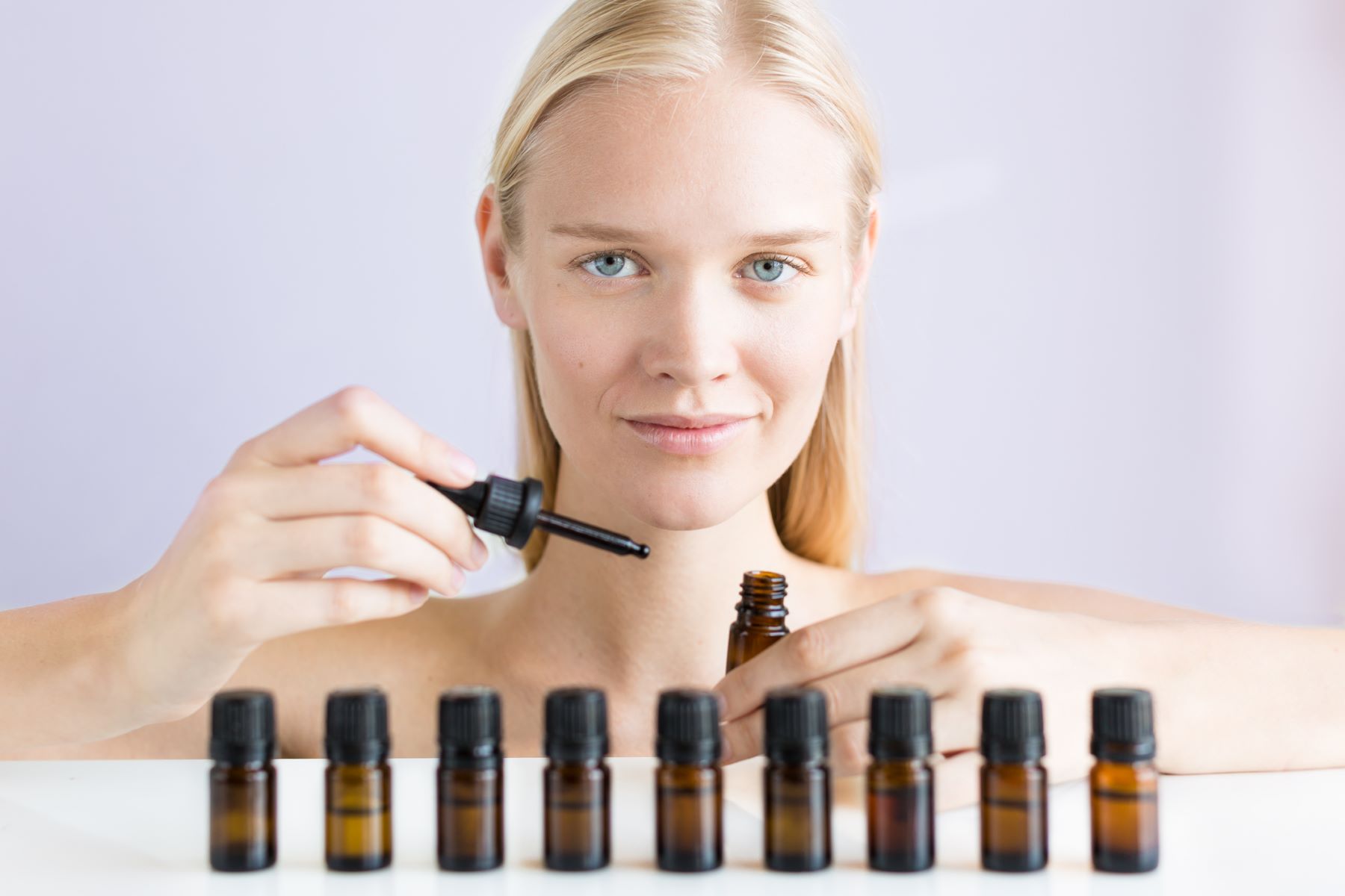 Woman testing different hyaluronic acid hair solutions