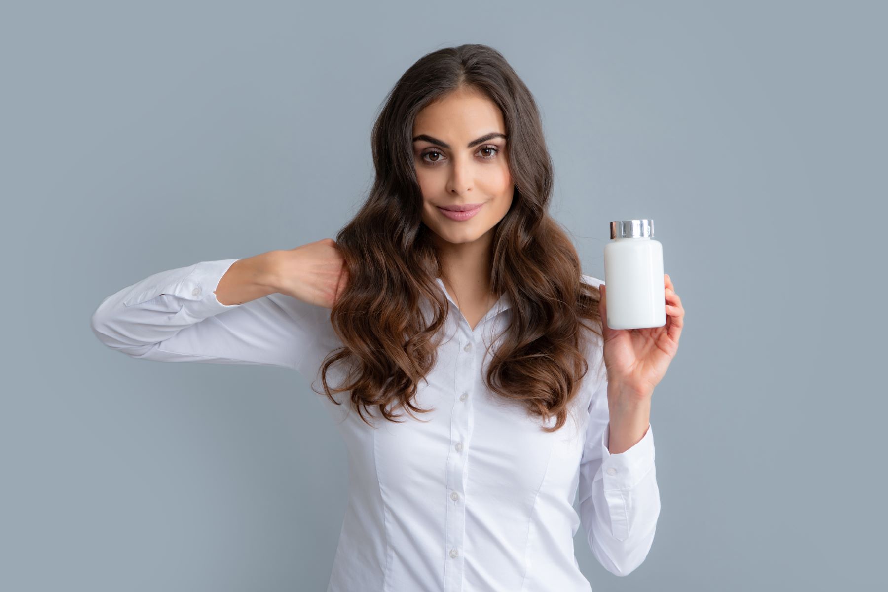 Woman using hair gummies for hair growth