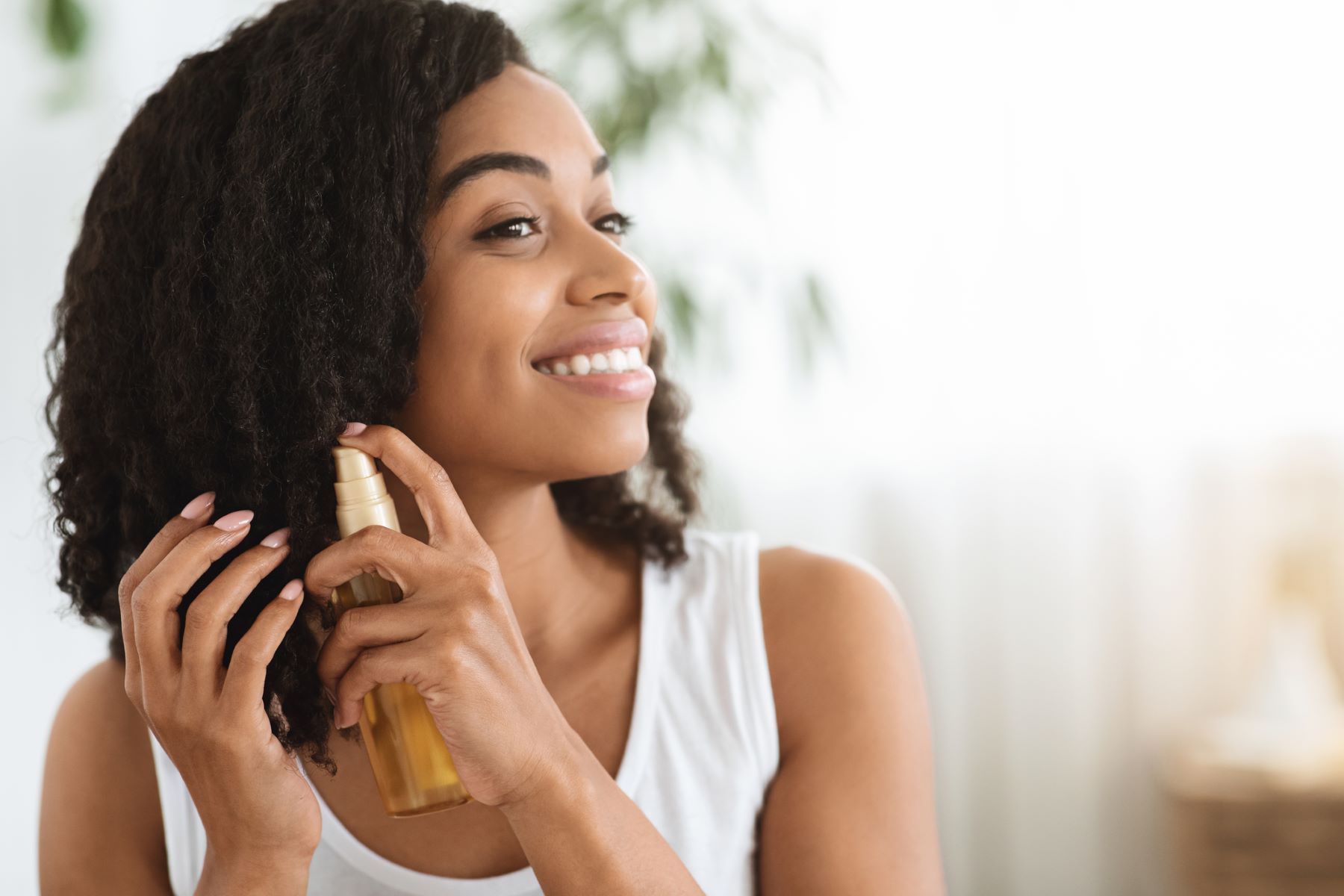 Woman using products for high porosity hair