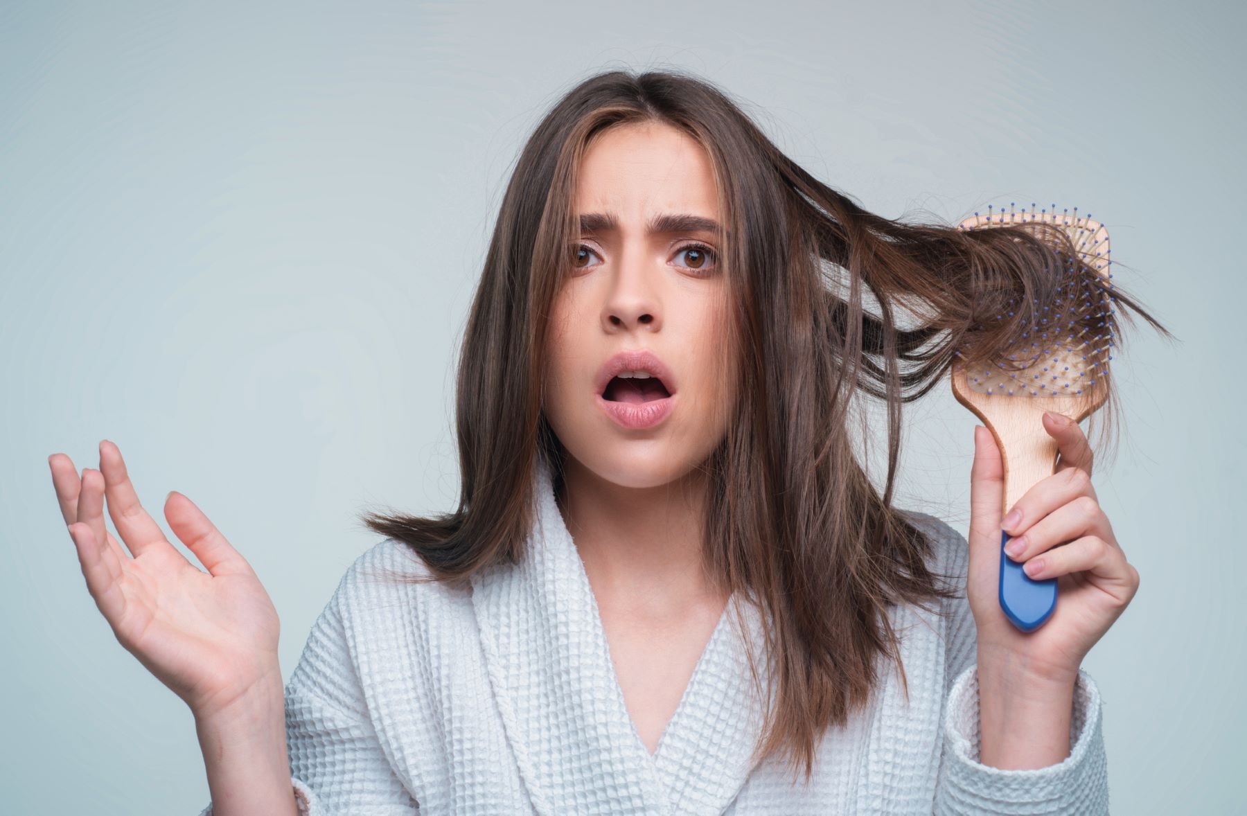 Woman wondering how to get hair volume