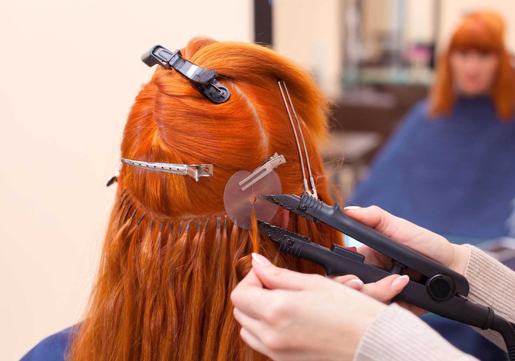 woman getting hair extensions