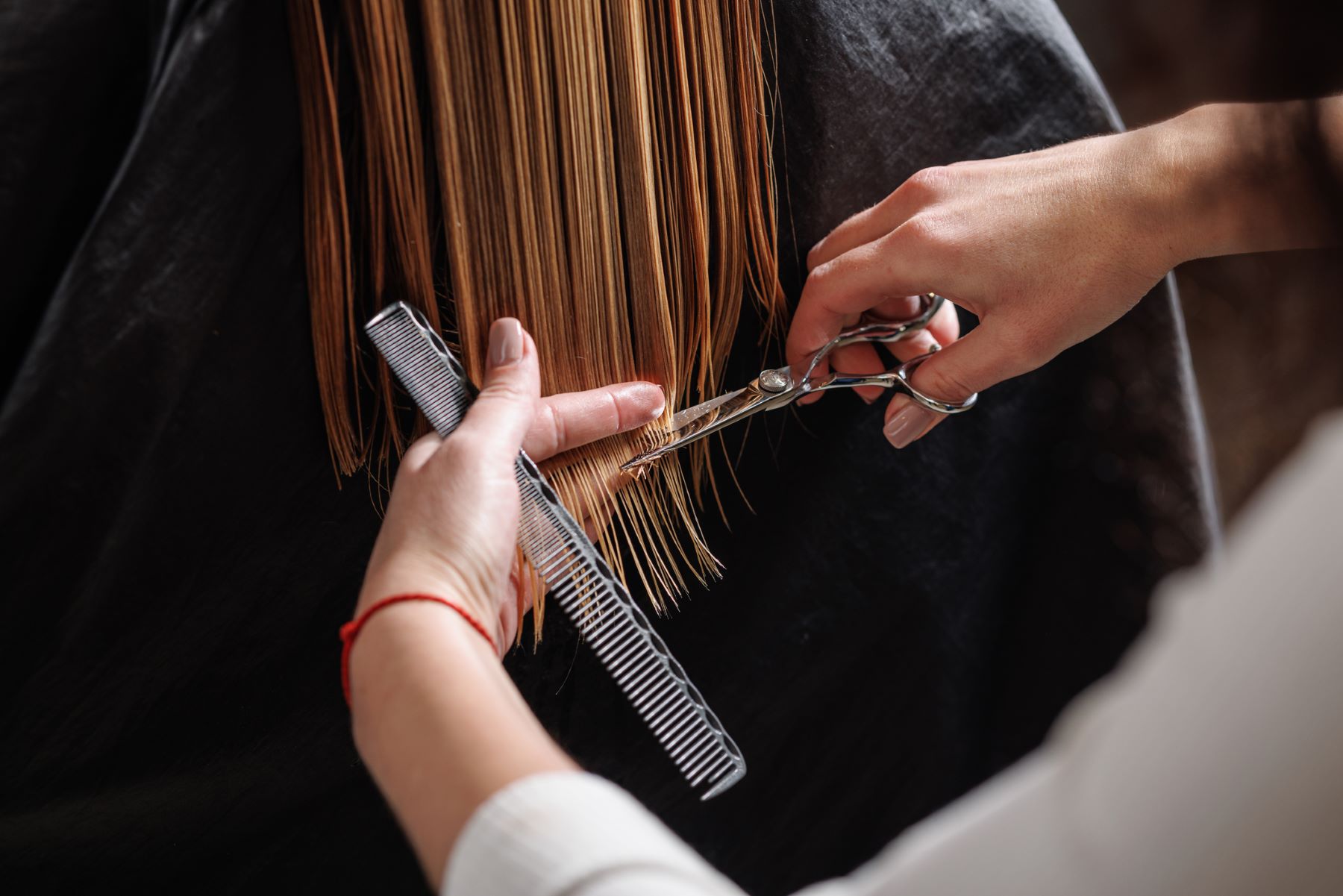 Woman getting a hair trim