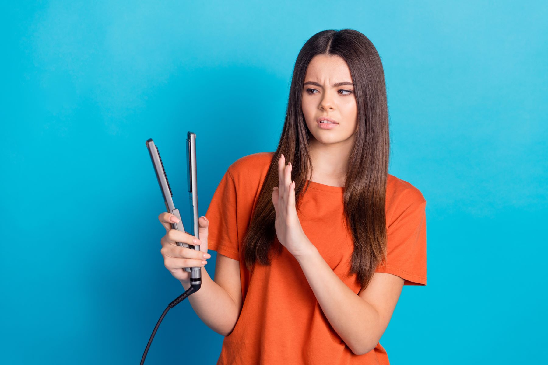 woman taking a break from heat styling