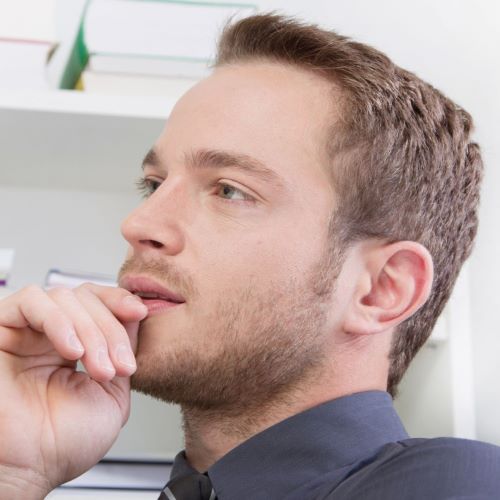 Man with short beard and unblended sideburns