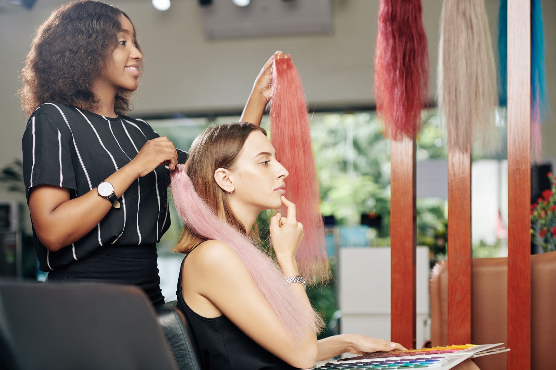 Woman choosing permanent hair extensions