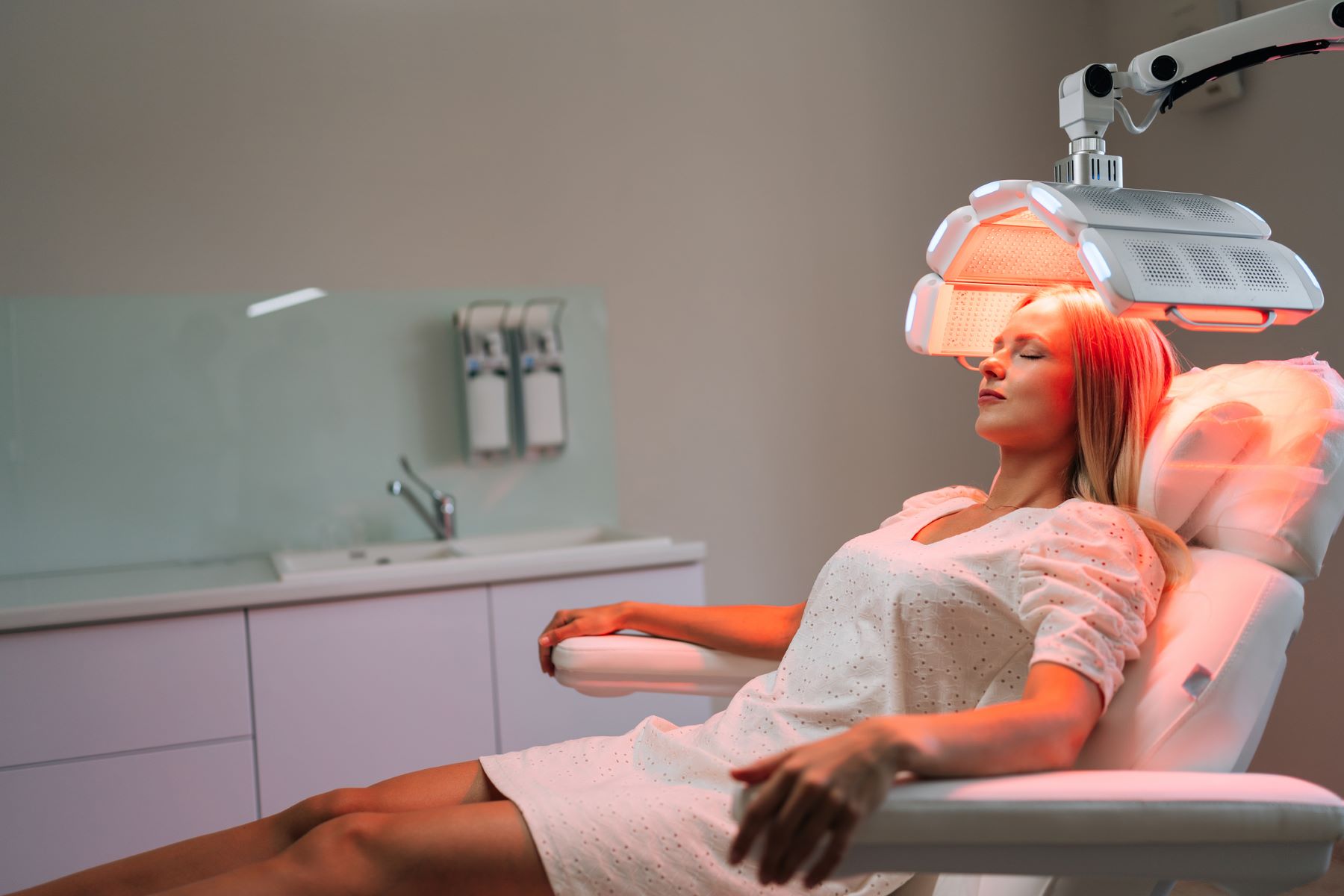 Woman getting hair growth therapy