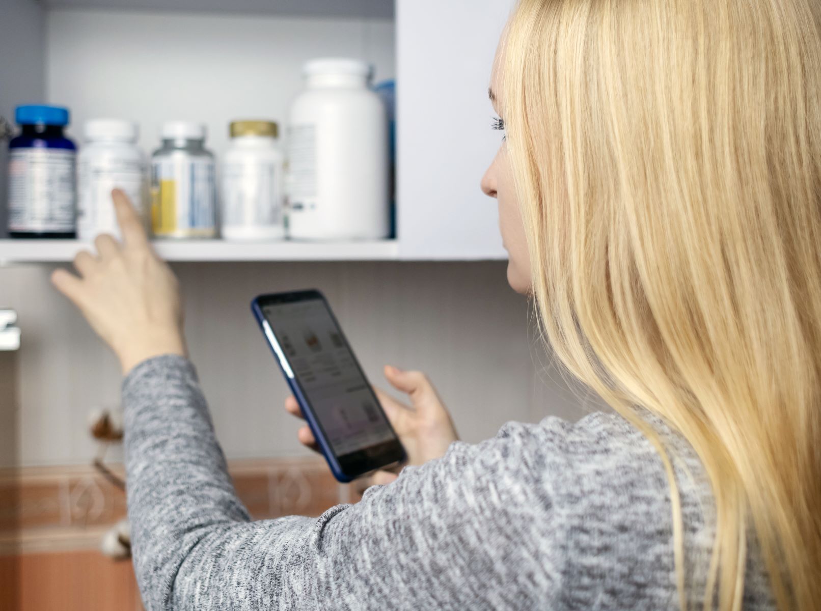 Woman researching what medication causes hair loss