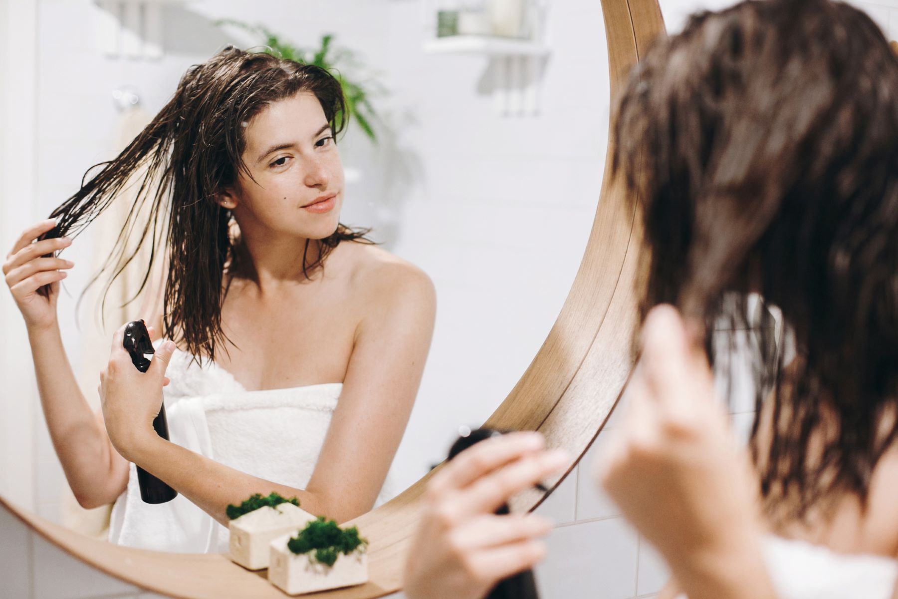 Woman styling and maintaining her hair