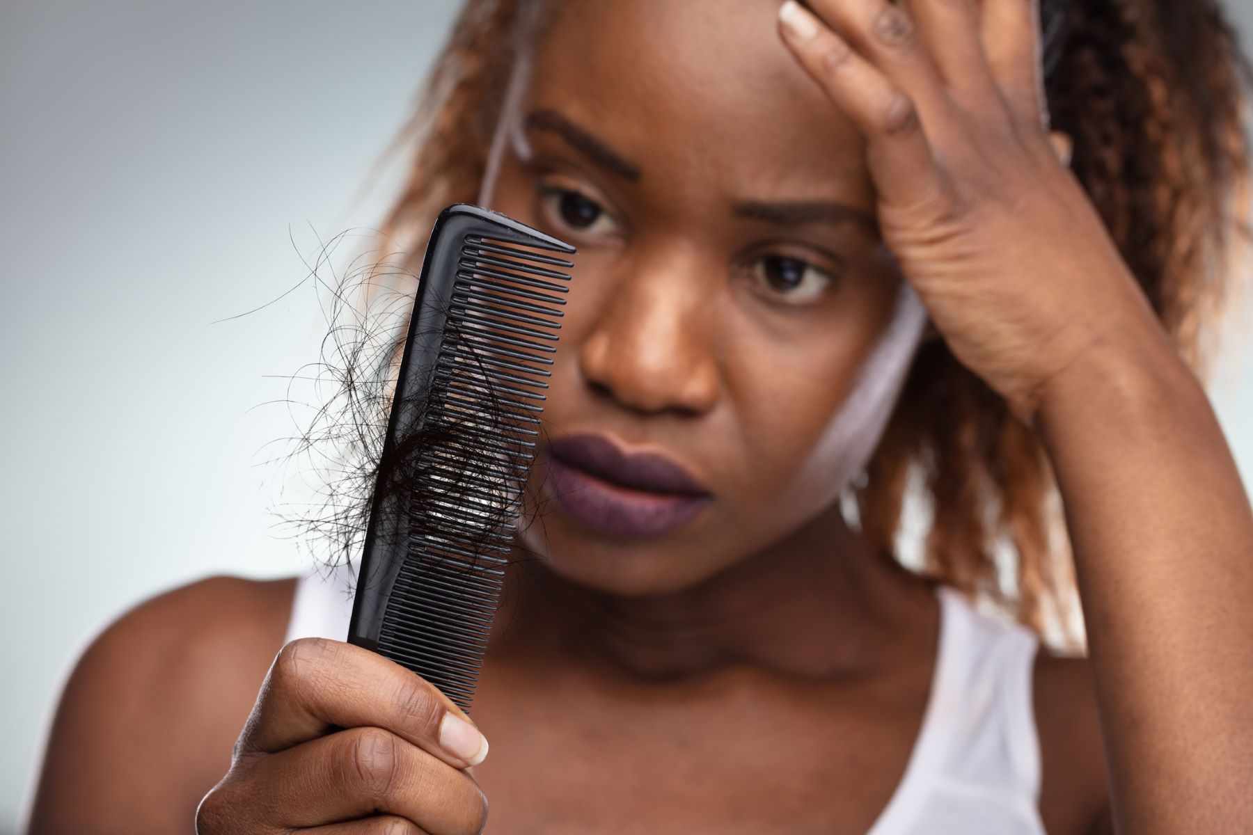 Woman wondering why her hair is thinning