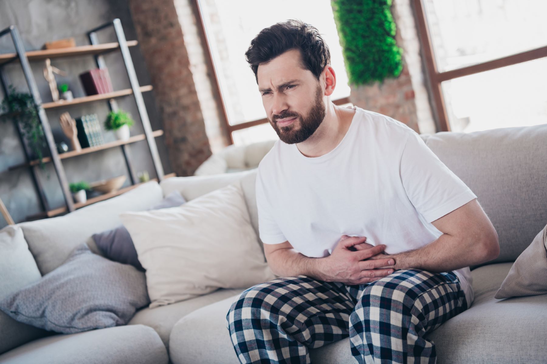 man experiencing Crohn’s disease-induced stress