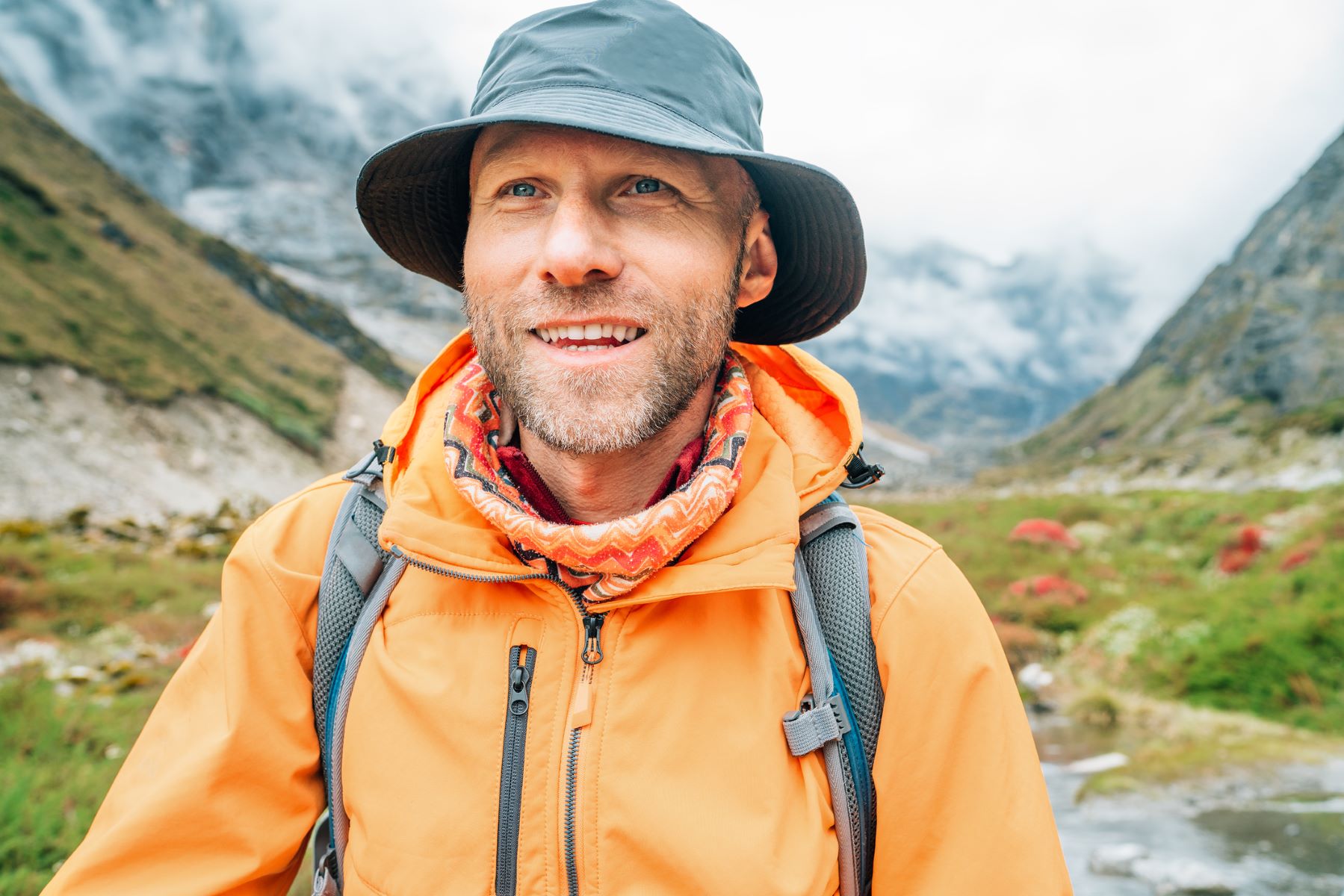 Man wearing hat during post-hair transplant walk