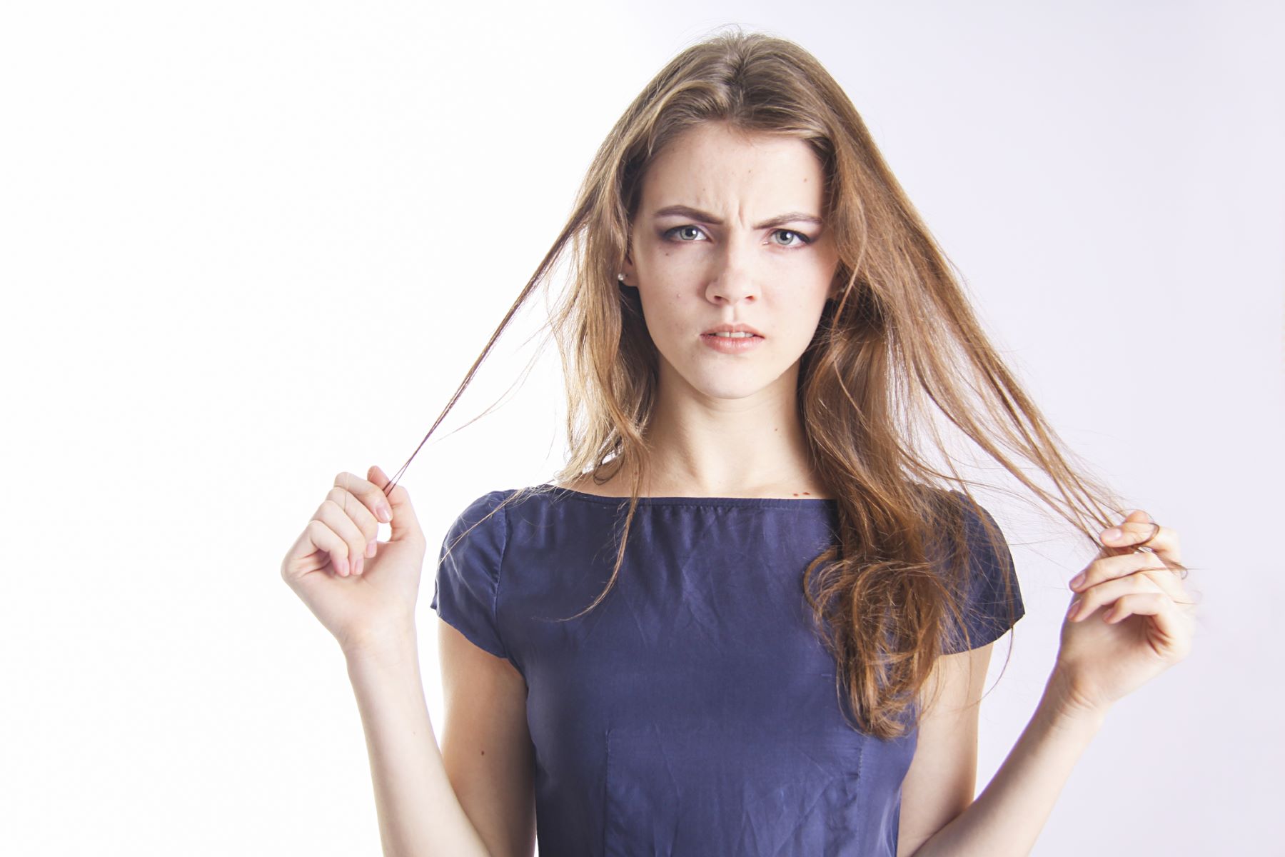 Woman feeling her dead hair