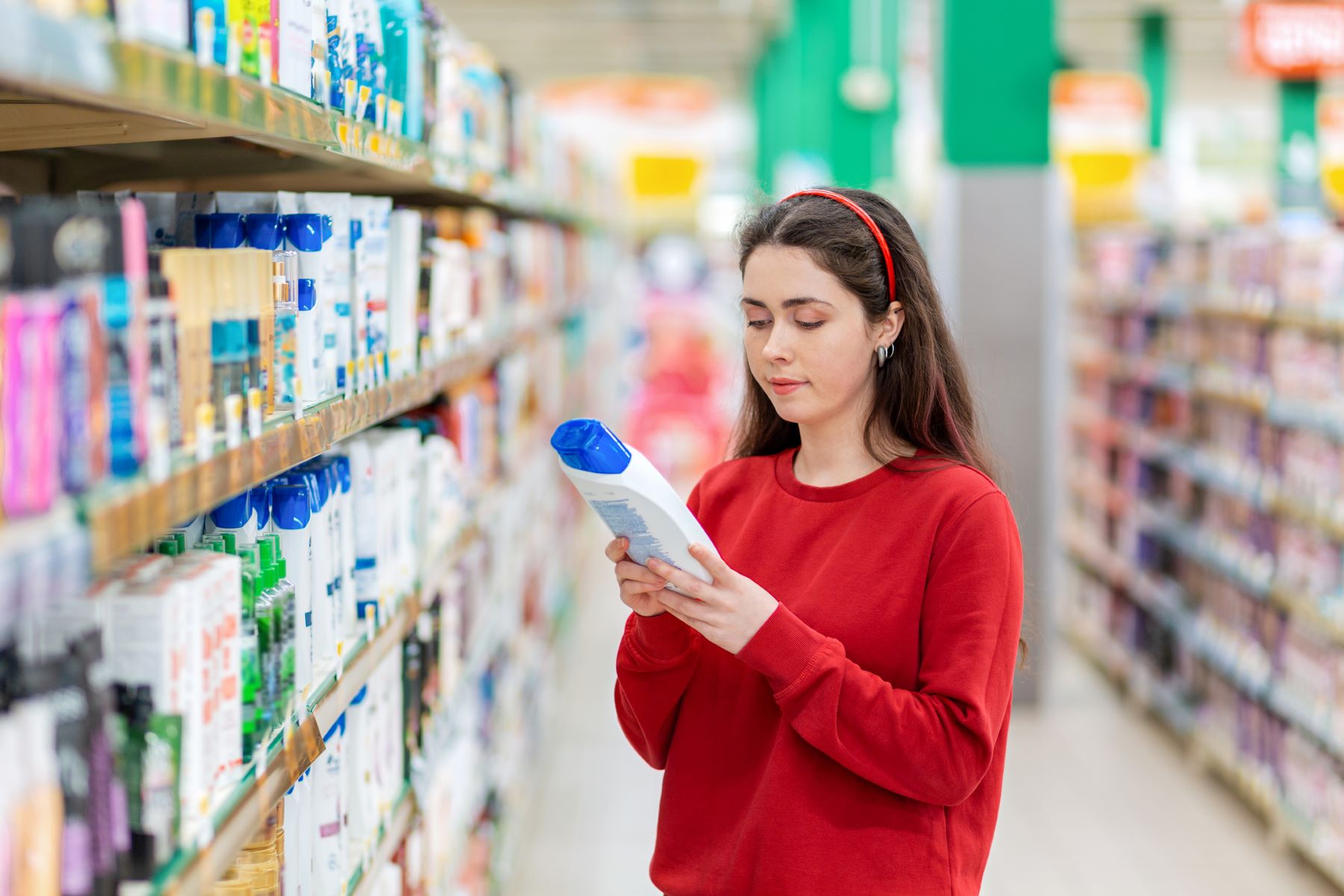 Woman checking Head & Shoulders ingredients