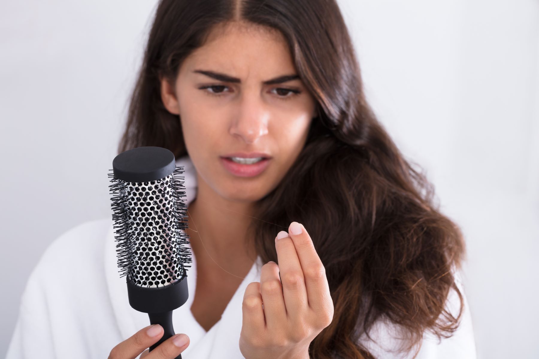 Woman experiencing hair loss