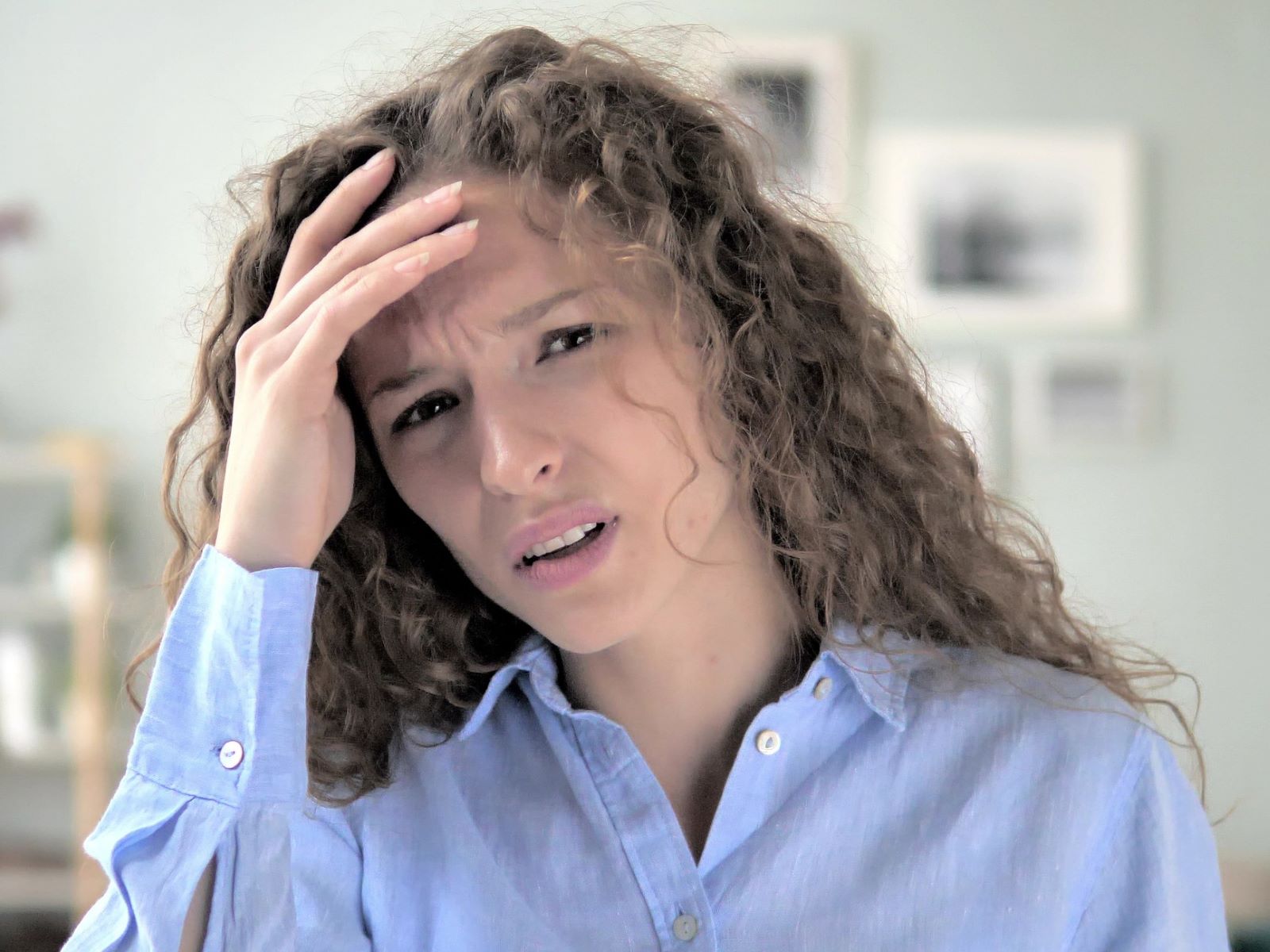 Woman with curly hair worried about hair loss