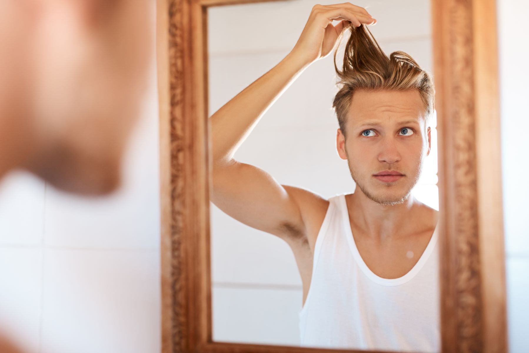 Man checking for hair growth