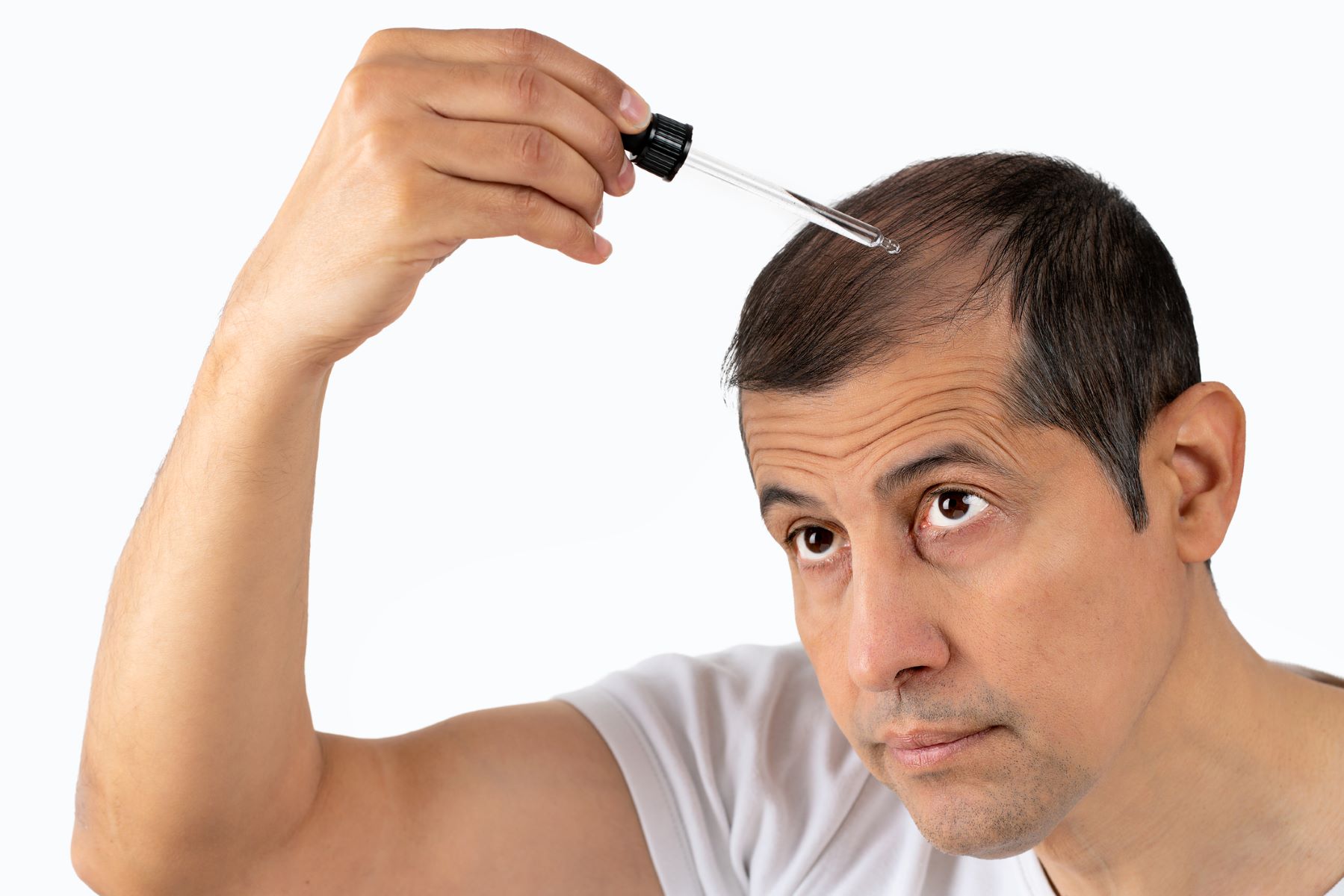 Man using hair treatment alternative to Nutrafol