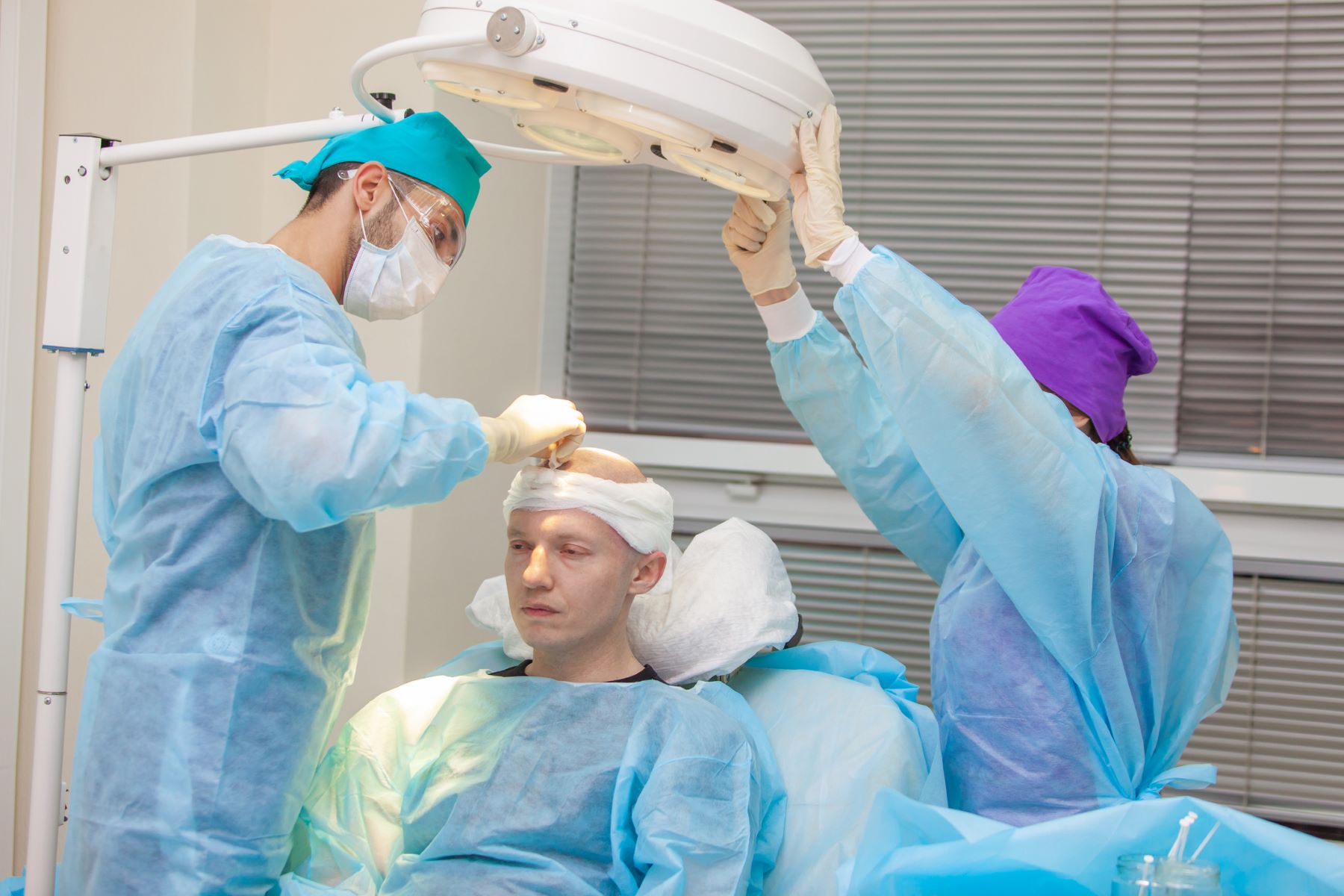 Patient getting needle-free hair transplant