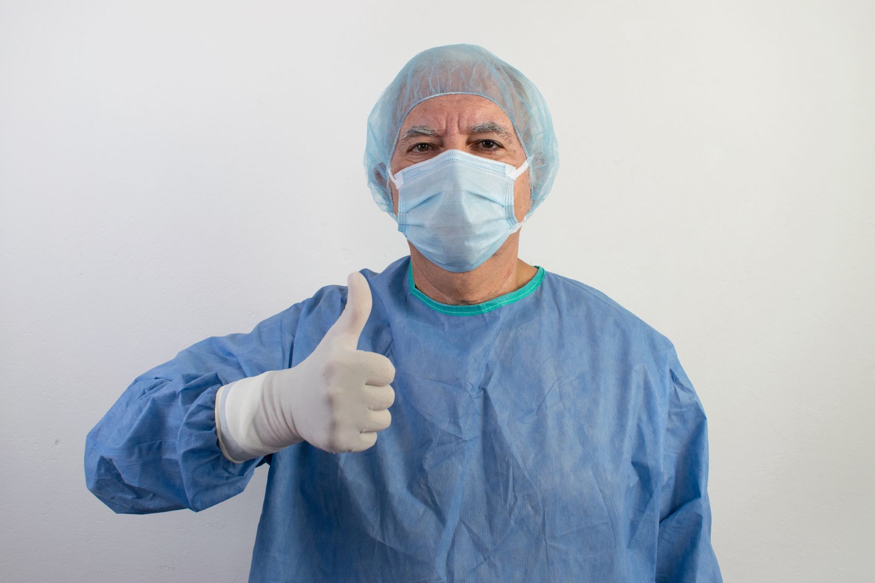 Surgeon approving of hair transplant recovery