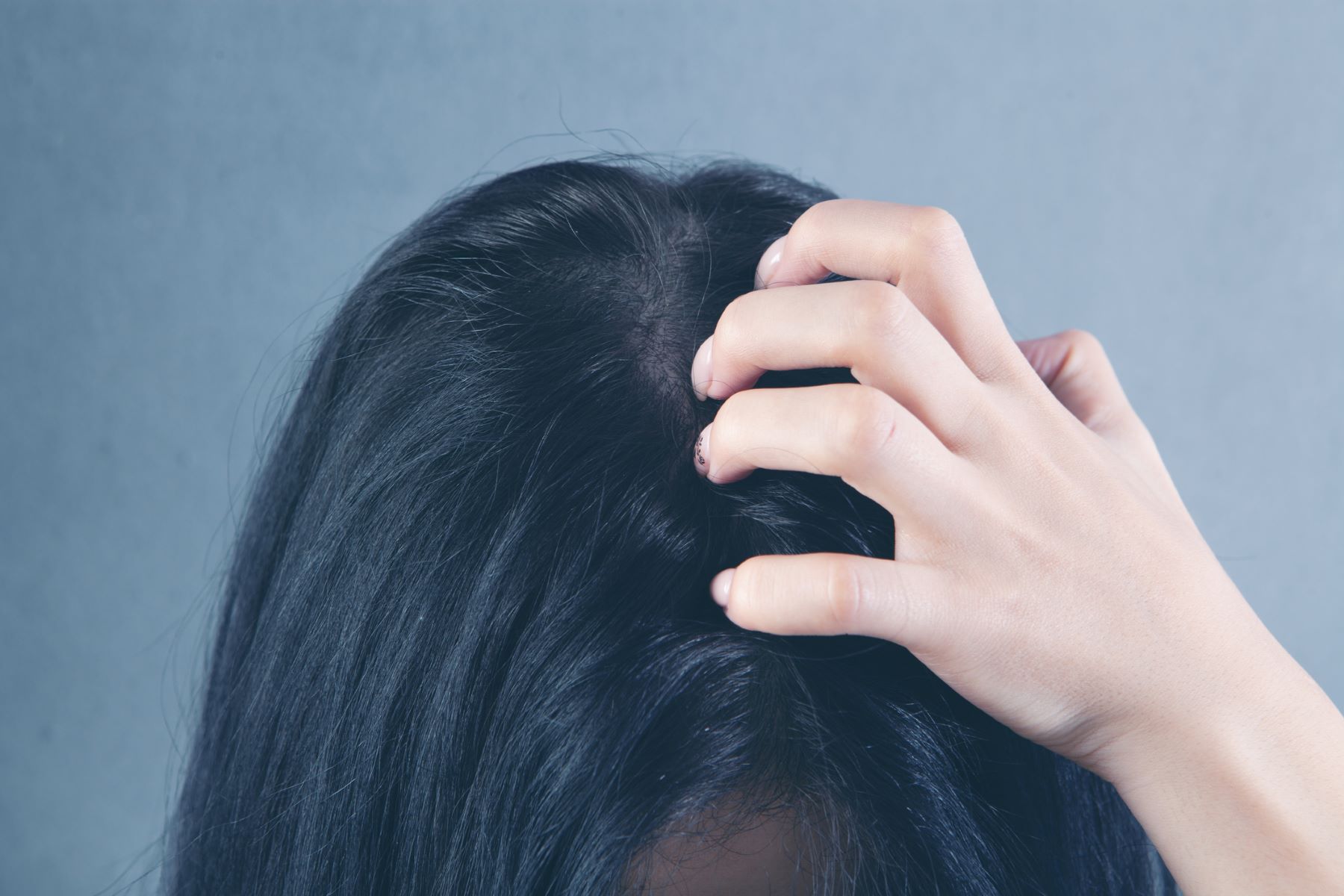 Woman with itchy scalp