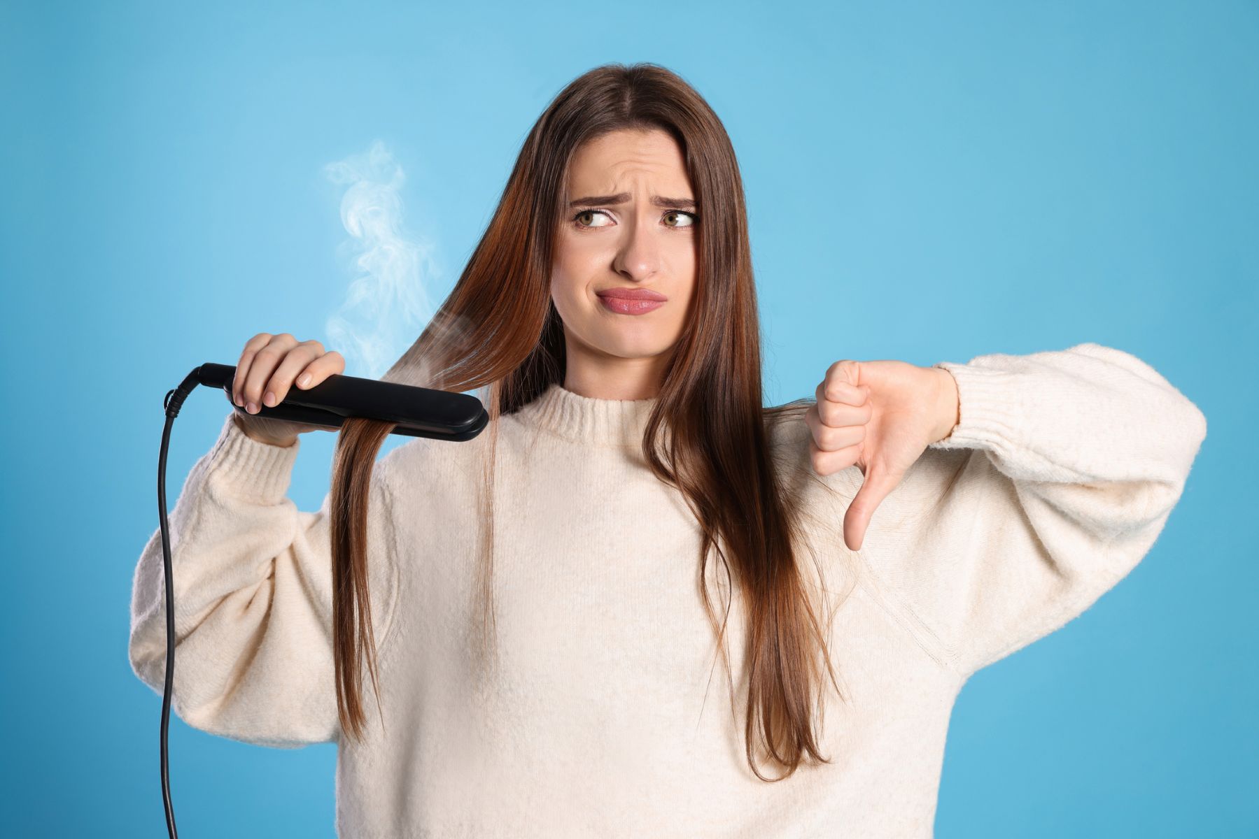 Woman disapproving of heat styling