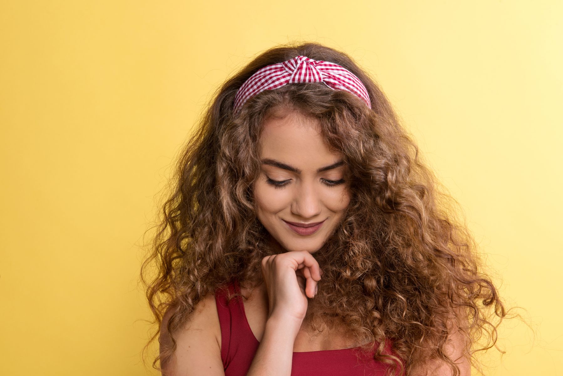 Woman masking her temporal triangular alopecia