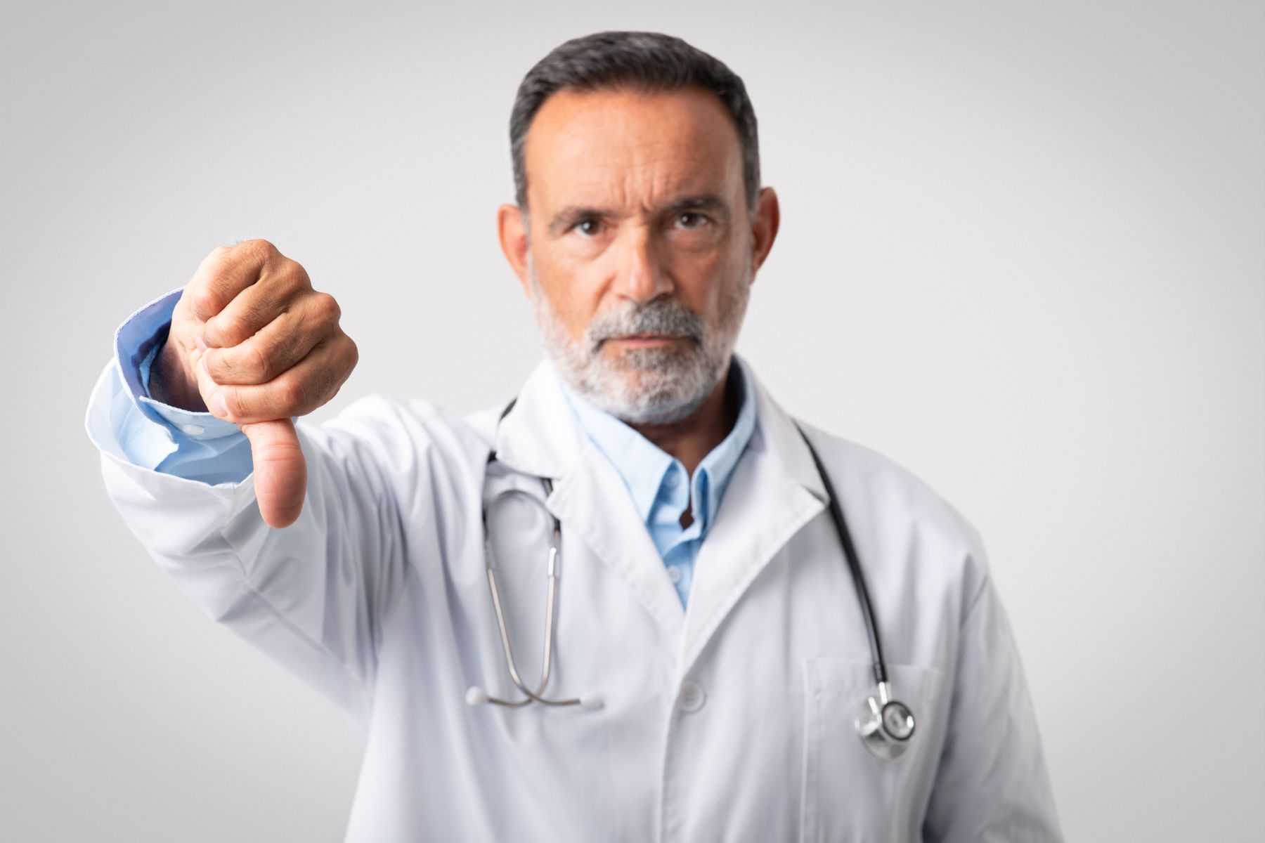 Doctor advising against oral Minoxidil