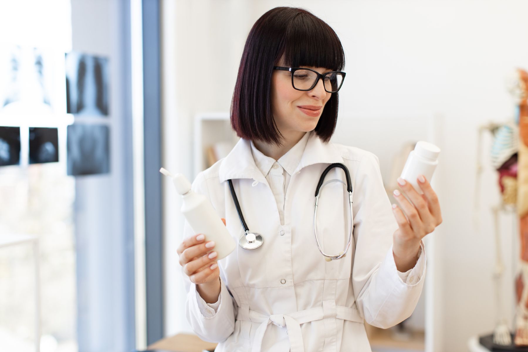 Doctor comparing oral and topical Minoxidil