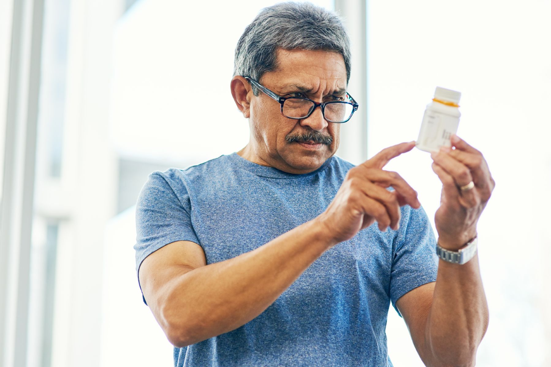 Man taking medicine as recommended