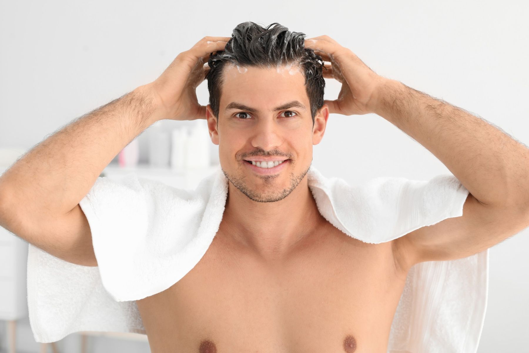 Man using hair conditioner