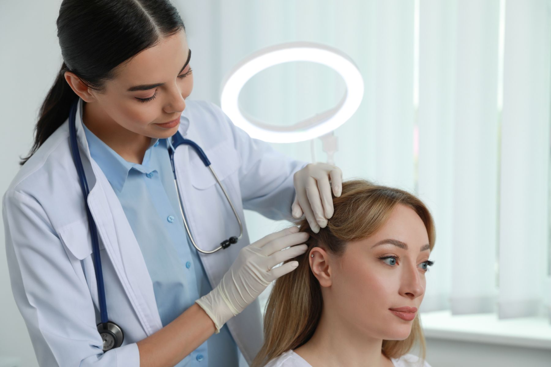 Trichologist assessing hair loss