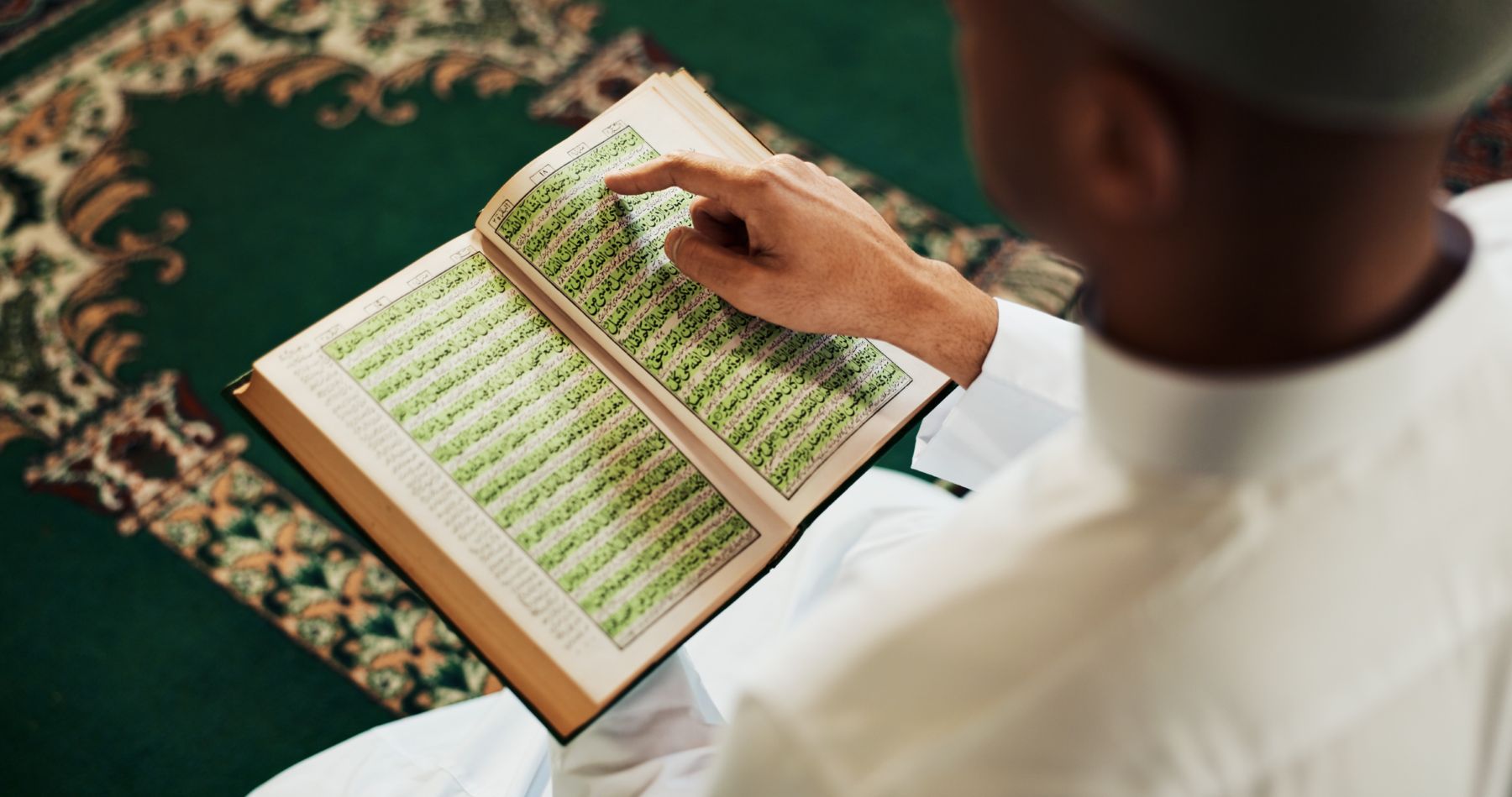 Muslim man reading whether a hair transplant is haram