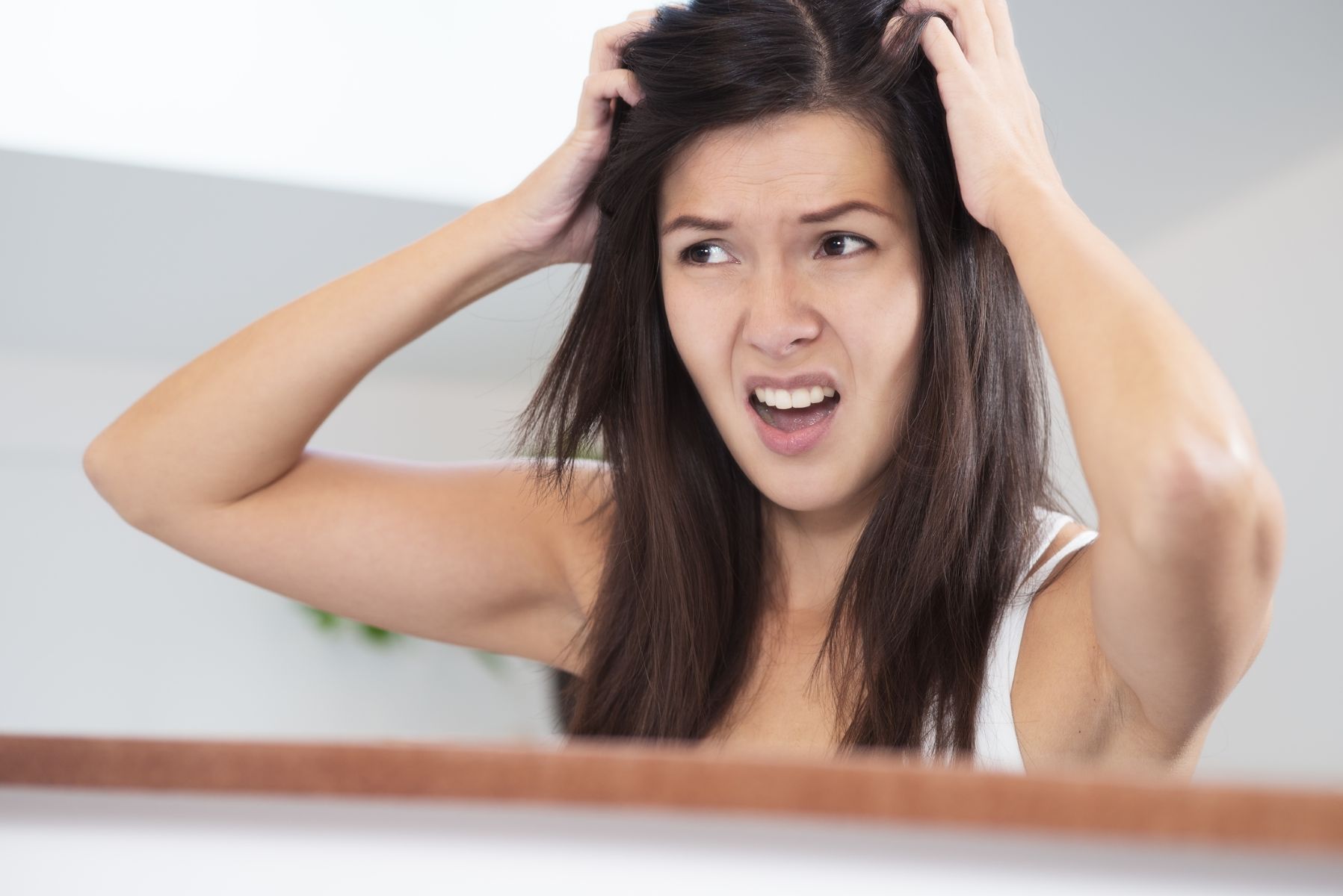 Woman experiencing almond oil side effects