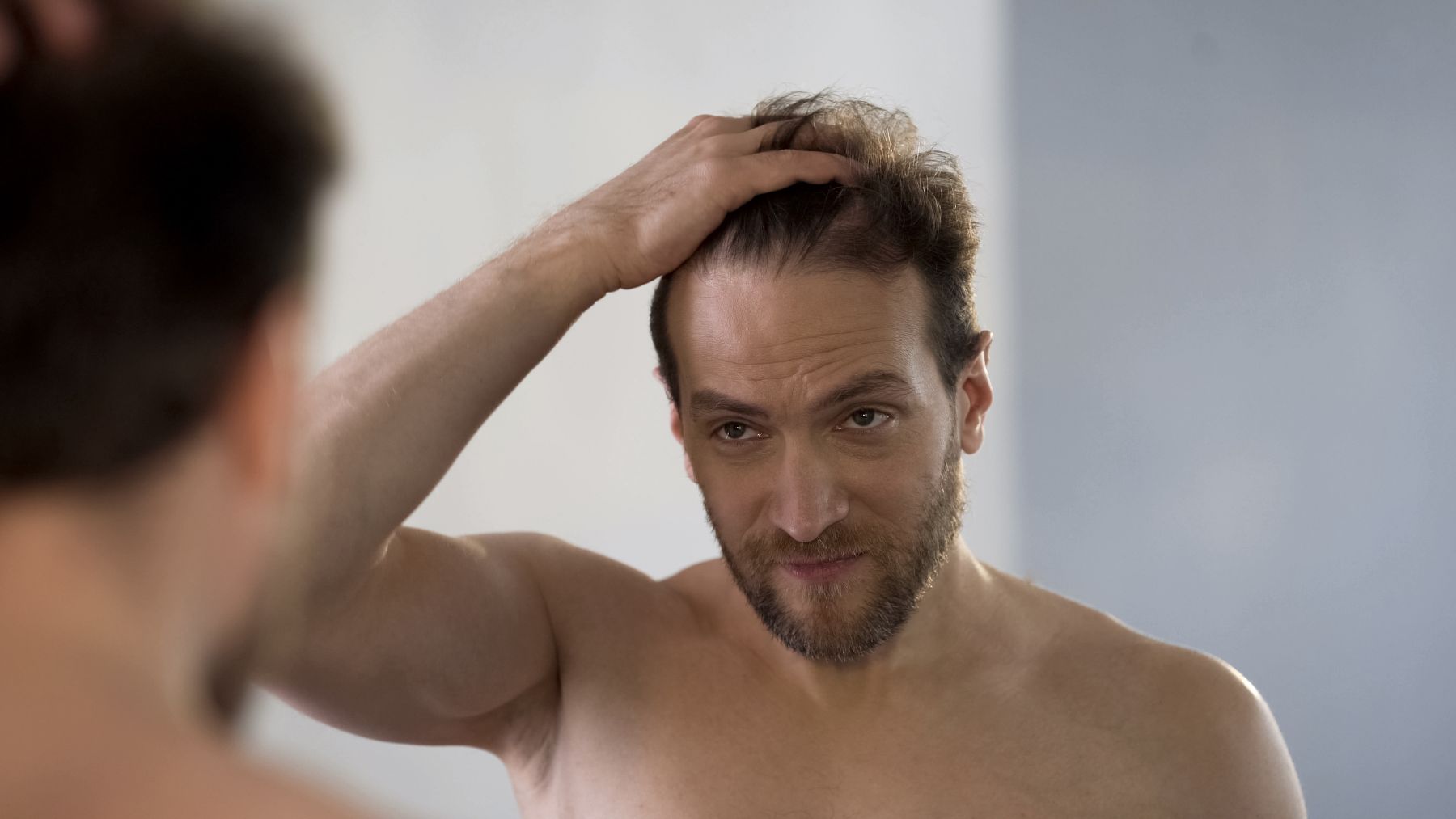 Man wondering whether Anavar causes hair loss