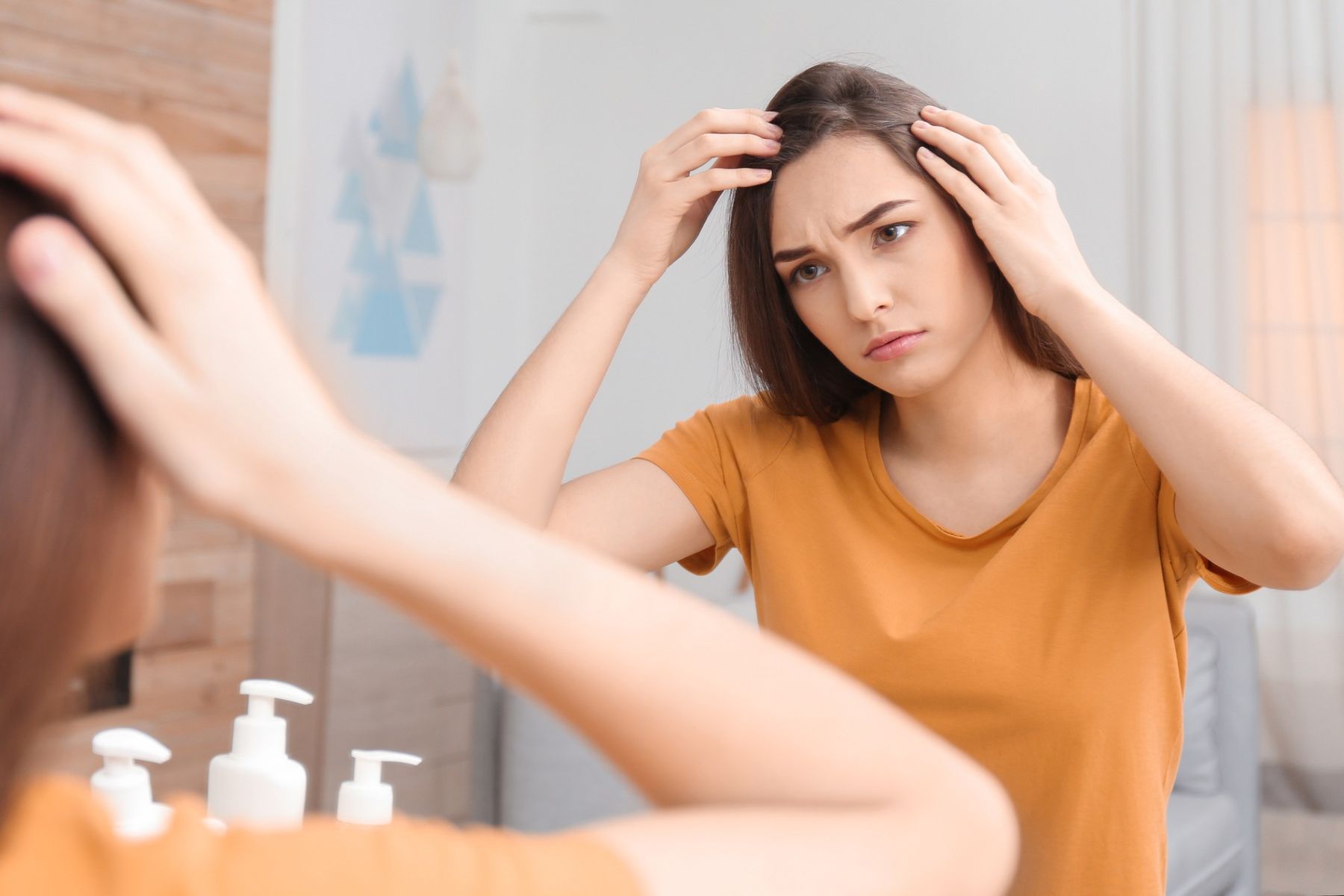 Woman experiencing Mirena IUD hair loss