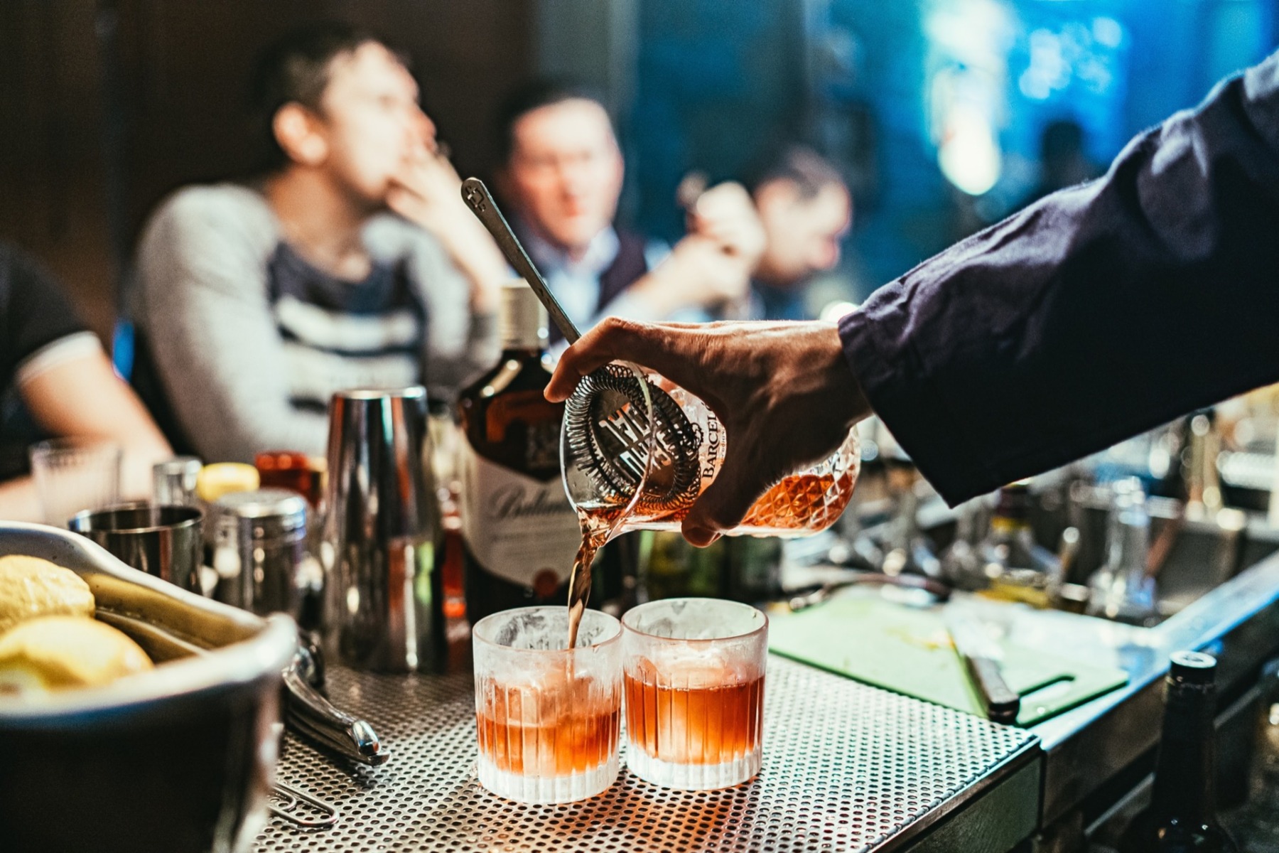 drinks being poured at a bar