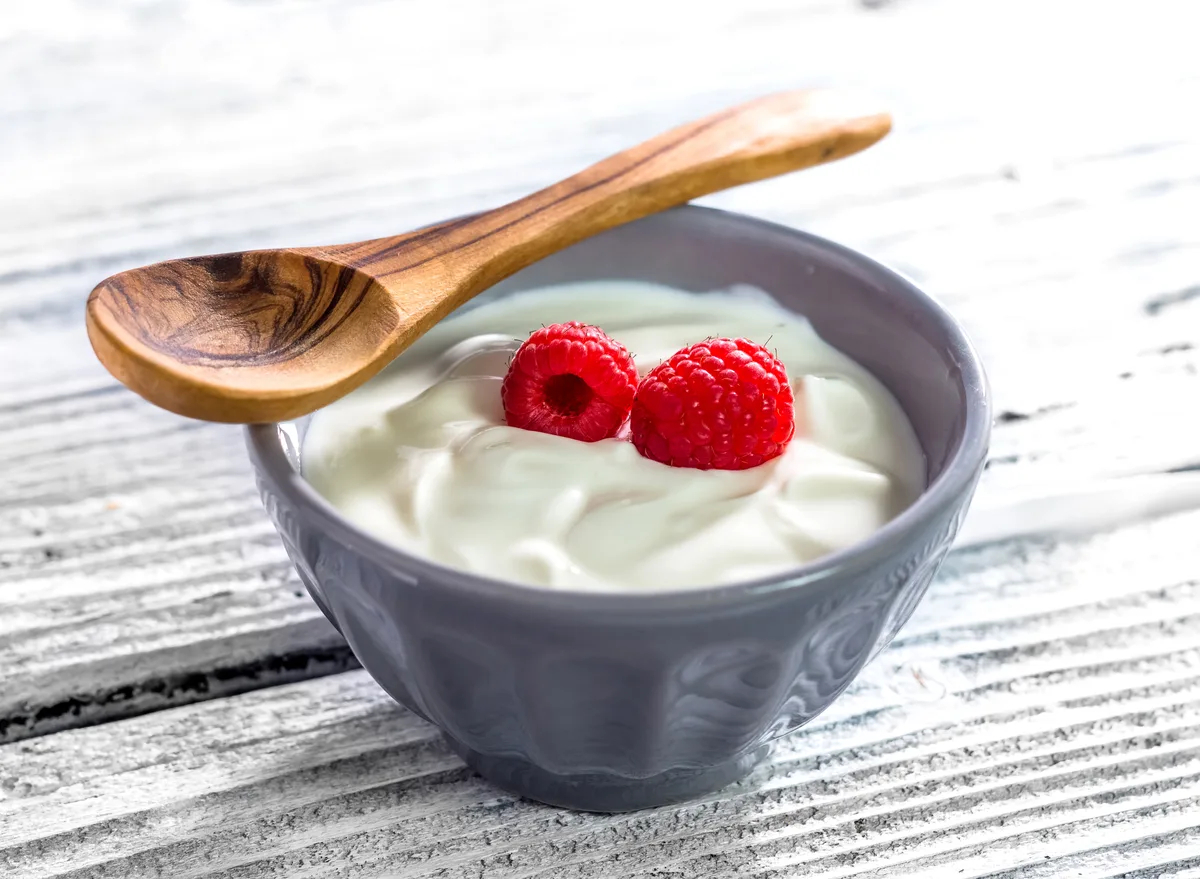Greek yoghurt in a bowl with raspberries