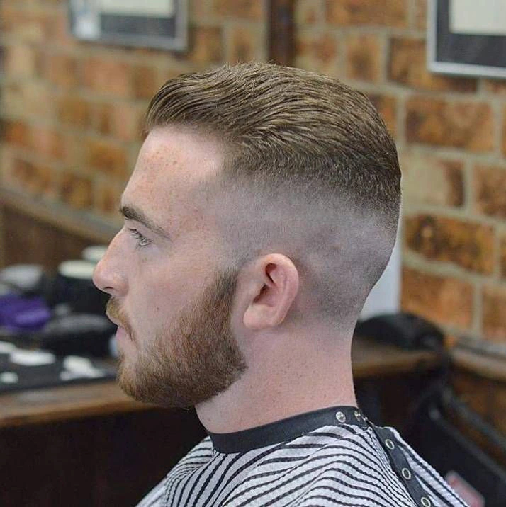 man in barber shop chair post-hair cut
