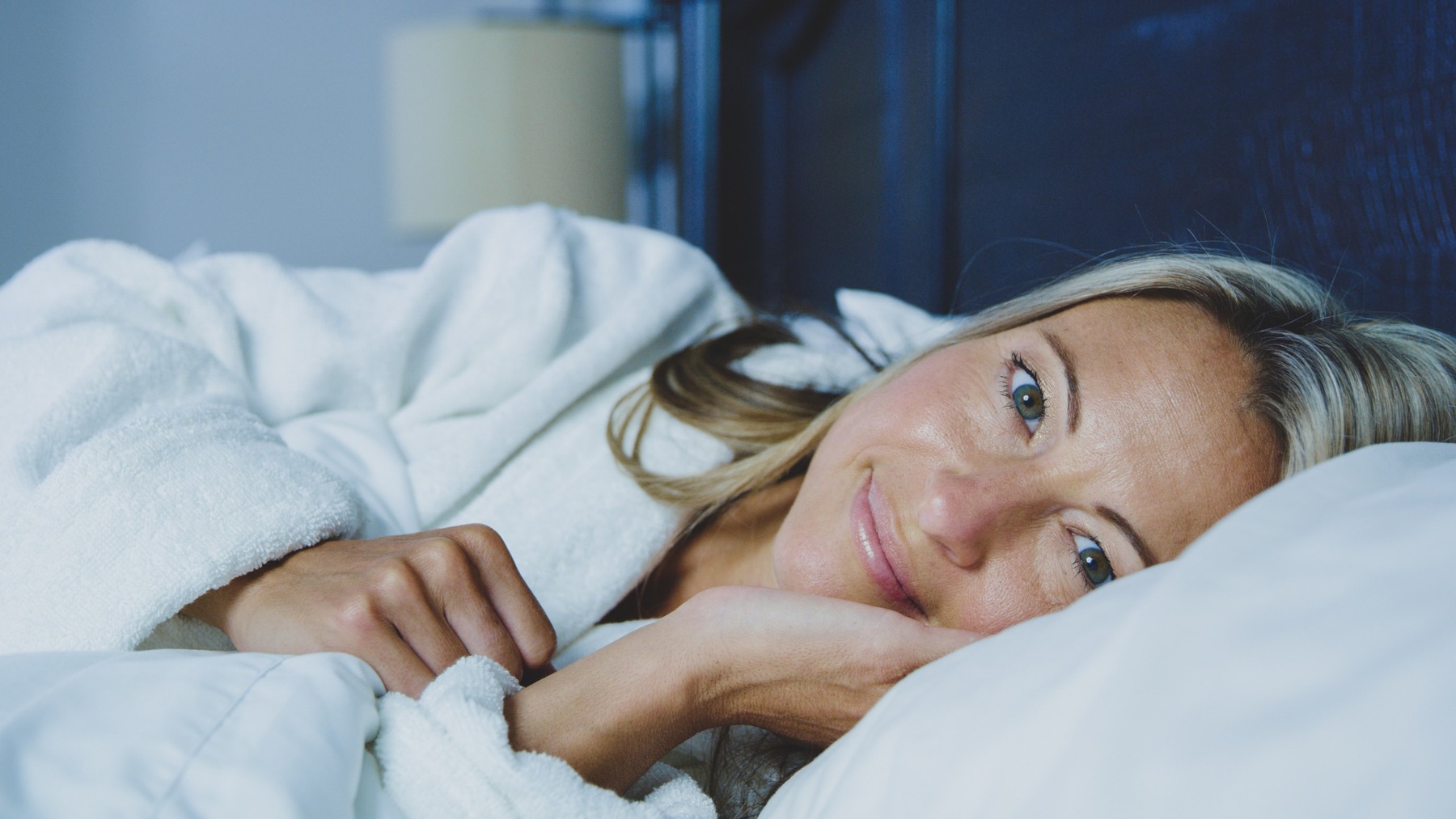 person sleeping on the best luxury silk pillowcase