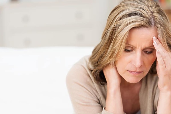 Stressed woman worrying about hair loss