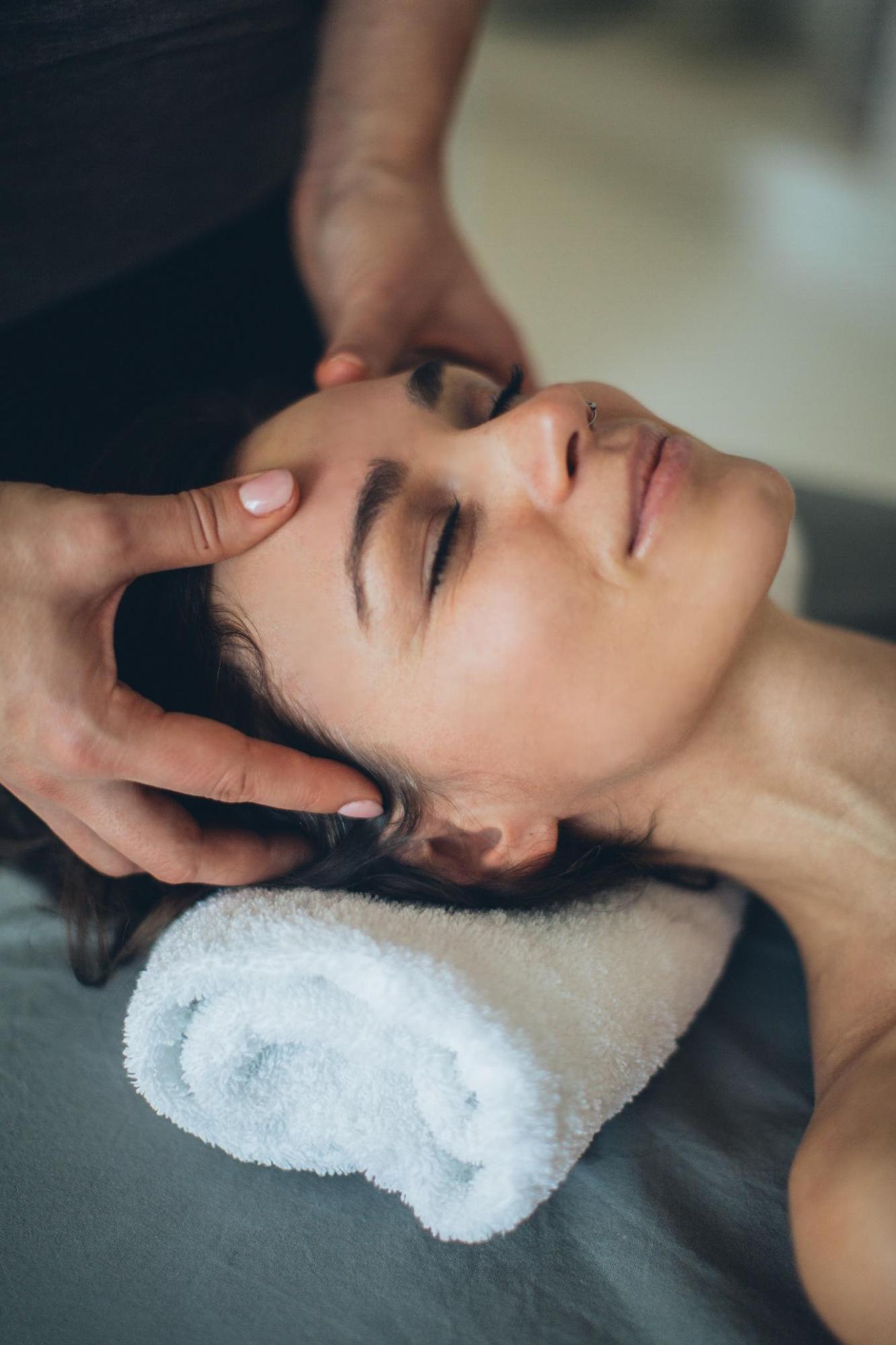 woman receiving a scalp massage