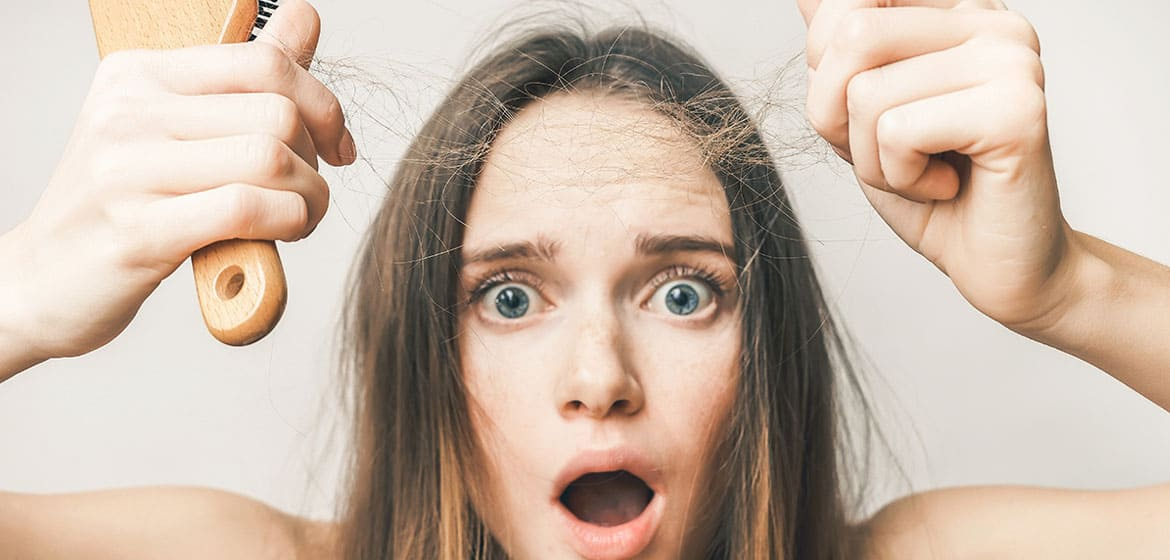 woman shocked at hair shedding